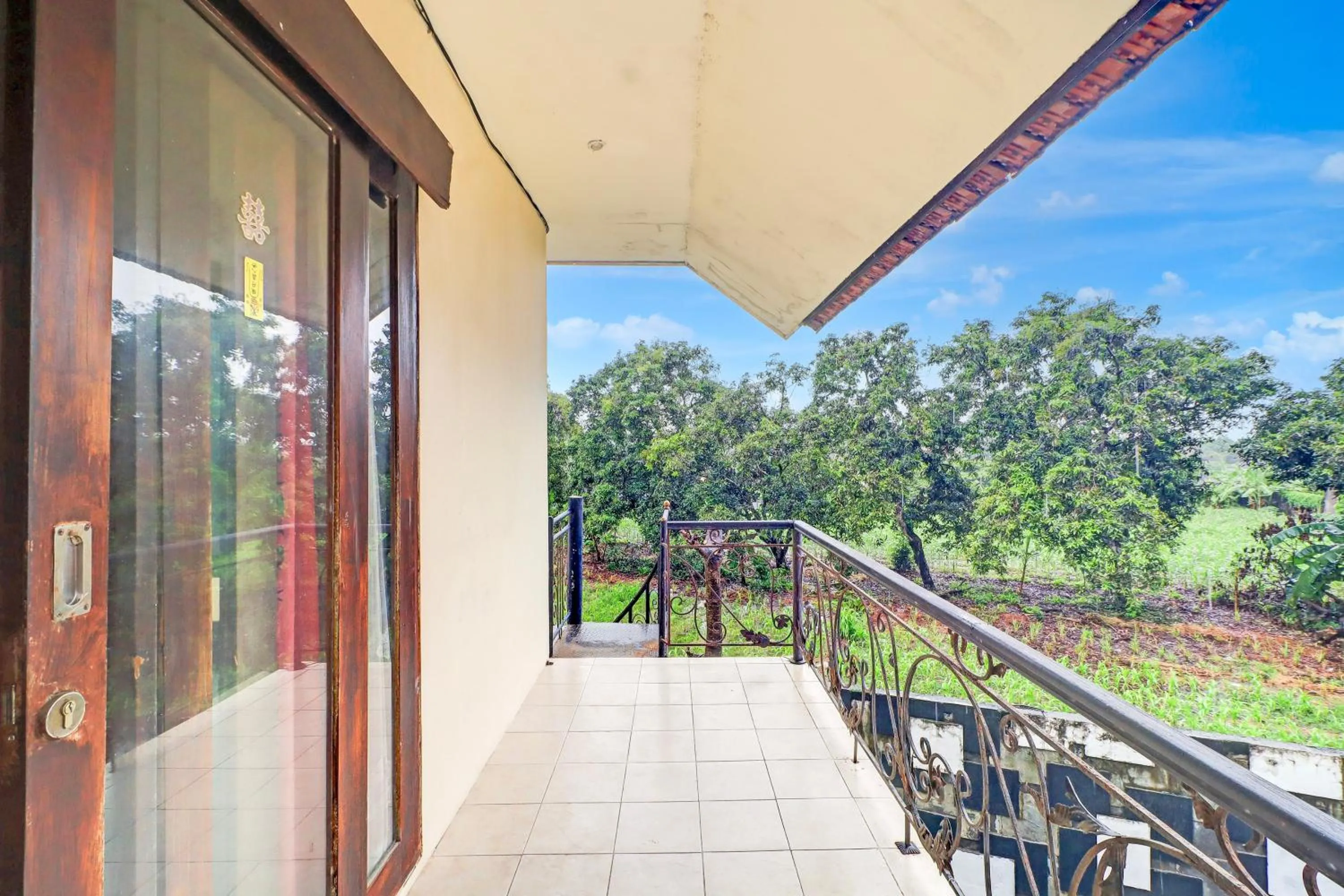 Bedroom in Collection O Putri Inn Homestay