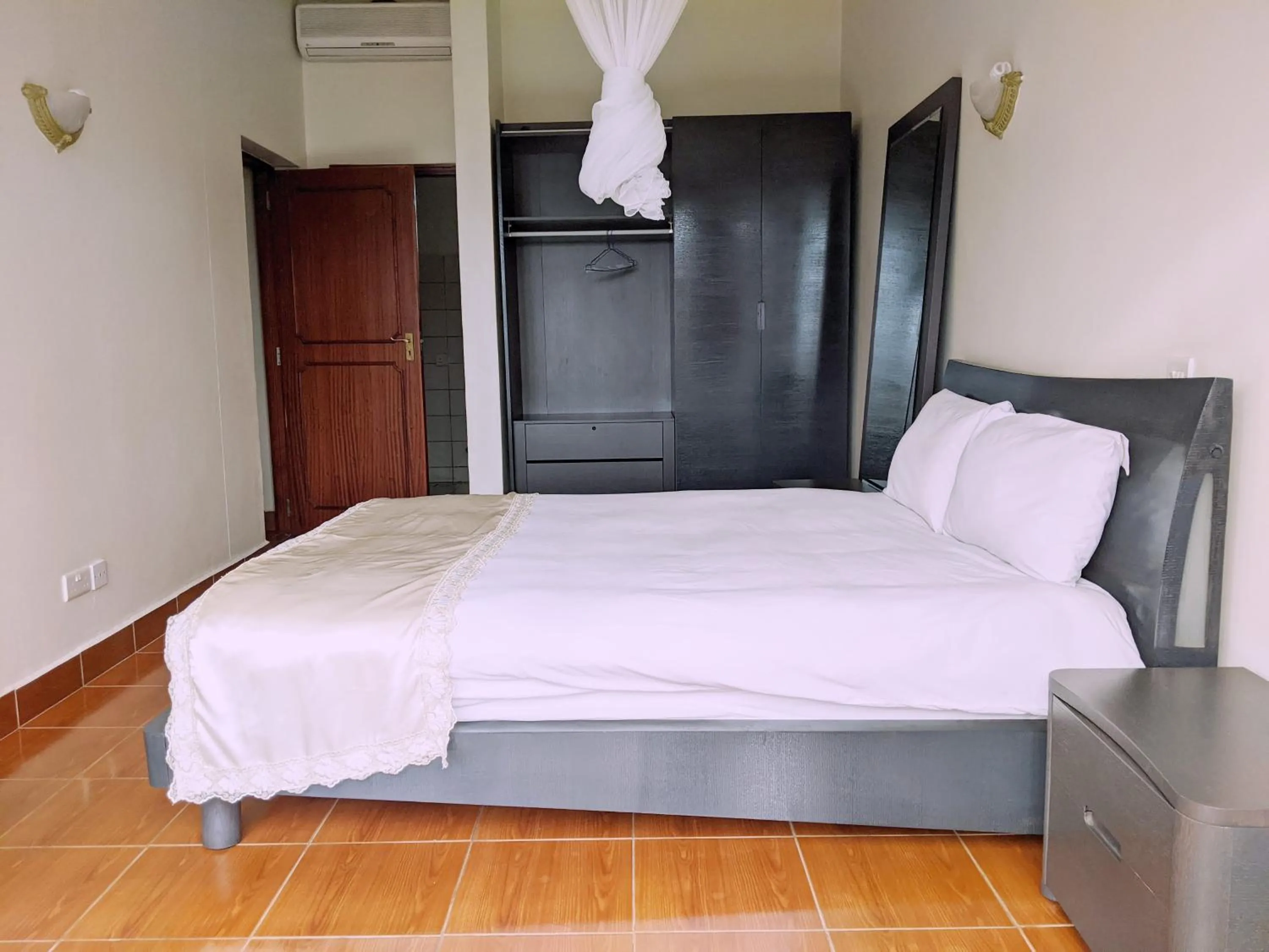 Bed in Prestige Hotel Suites