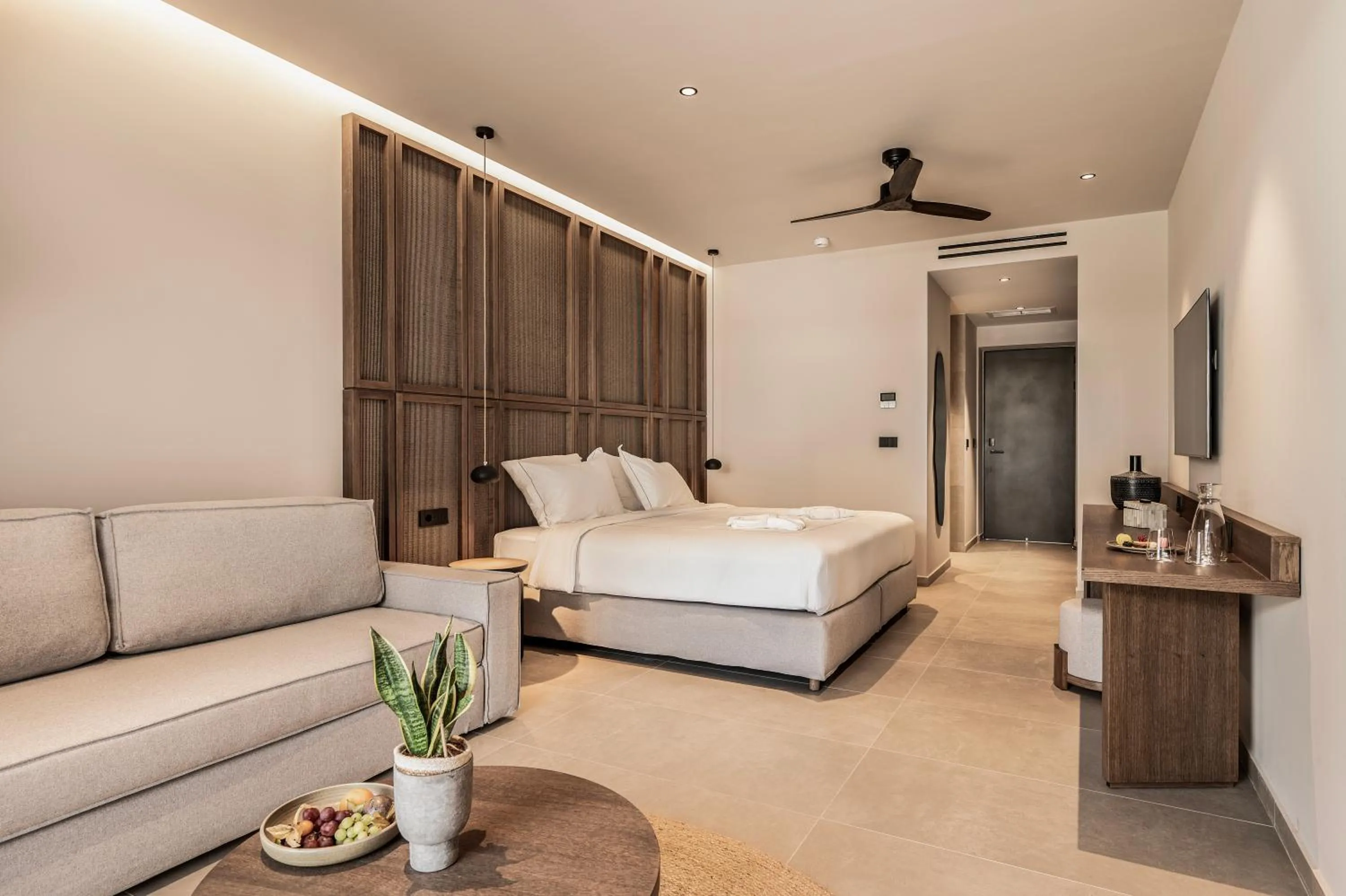 Seating area, Bed in Mosay All Suite Hotel