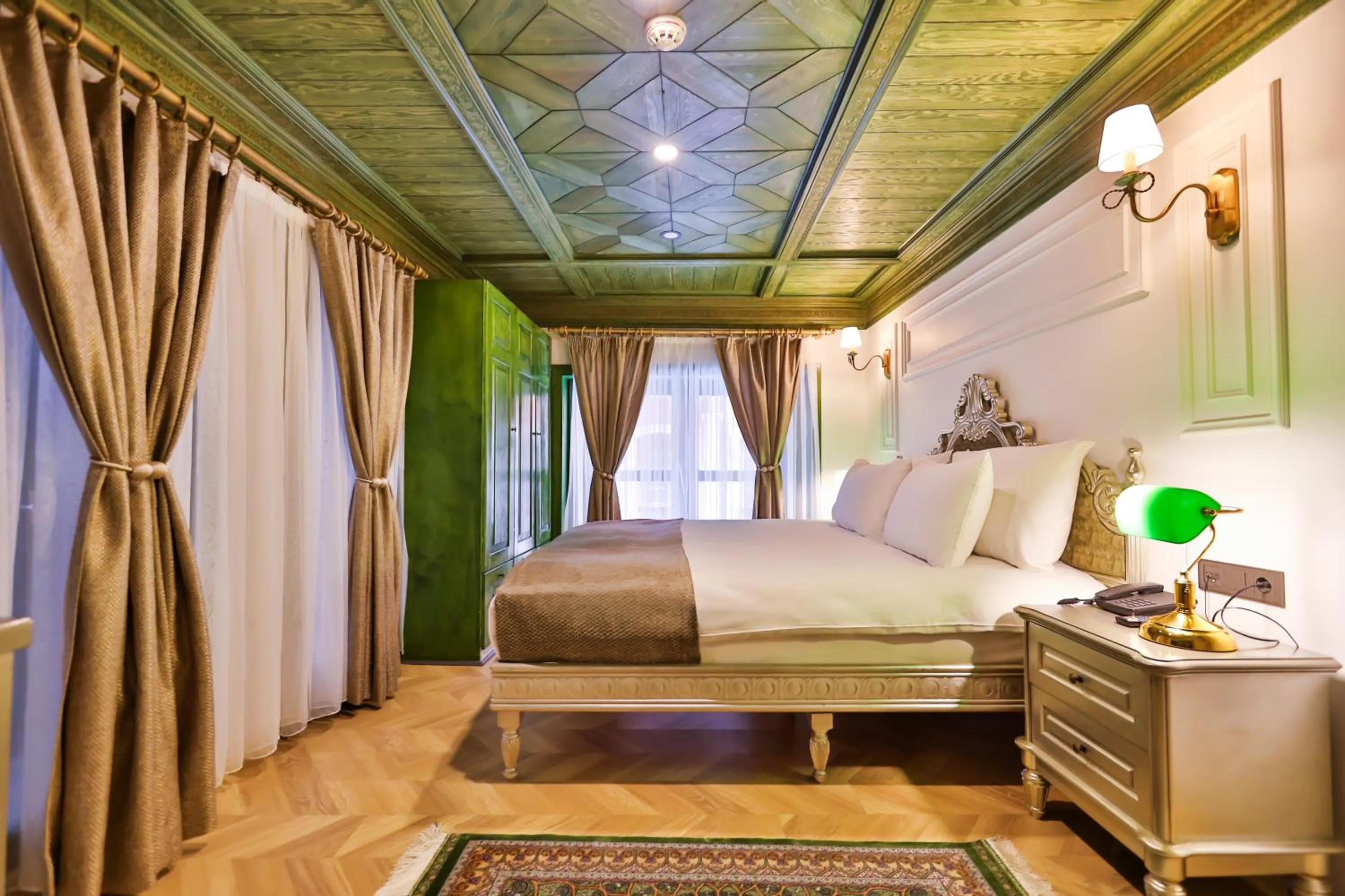 Bed in Emerald Mansion Hotel