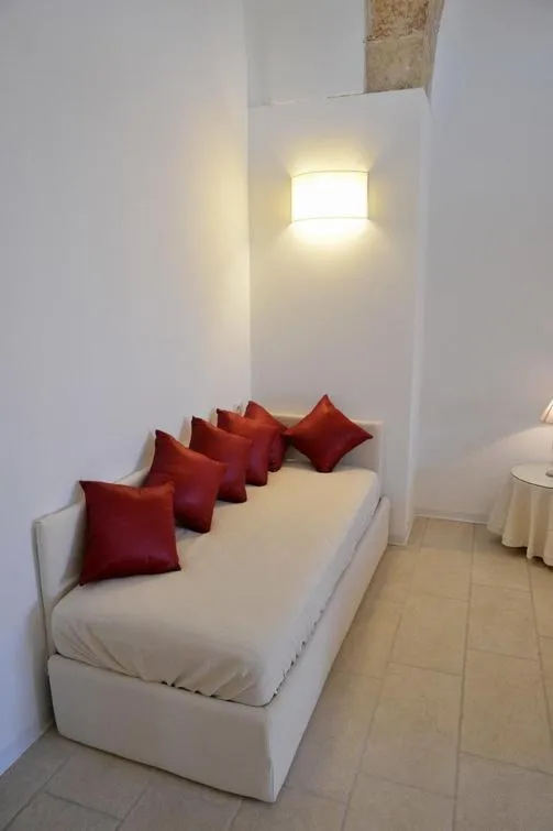 Seating area, Bed in Masseria Palane