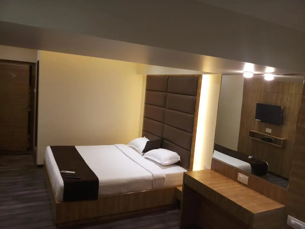 Bed in Hotel Heritage Dakshin