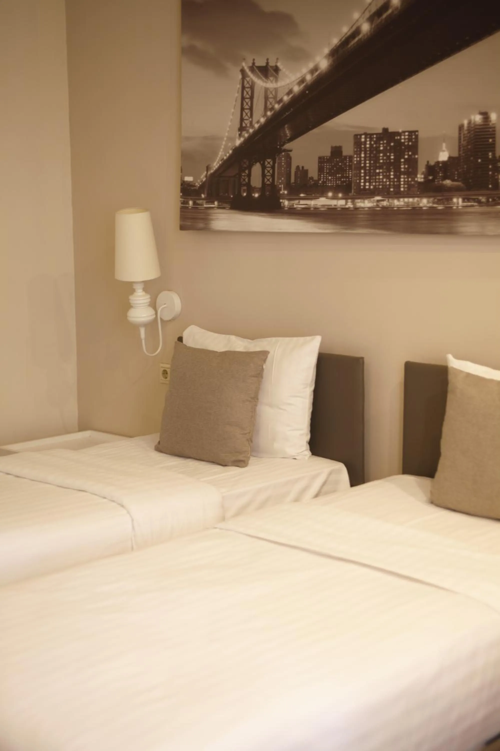 Bed in Opera Suite Hotel