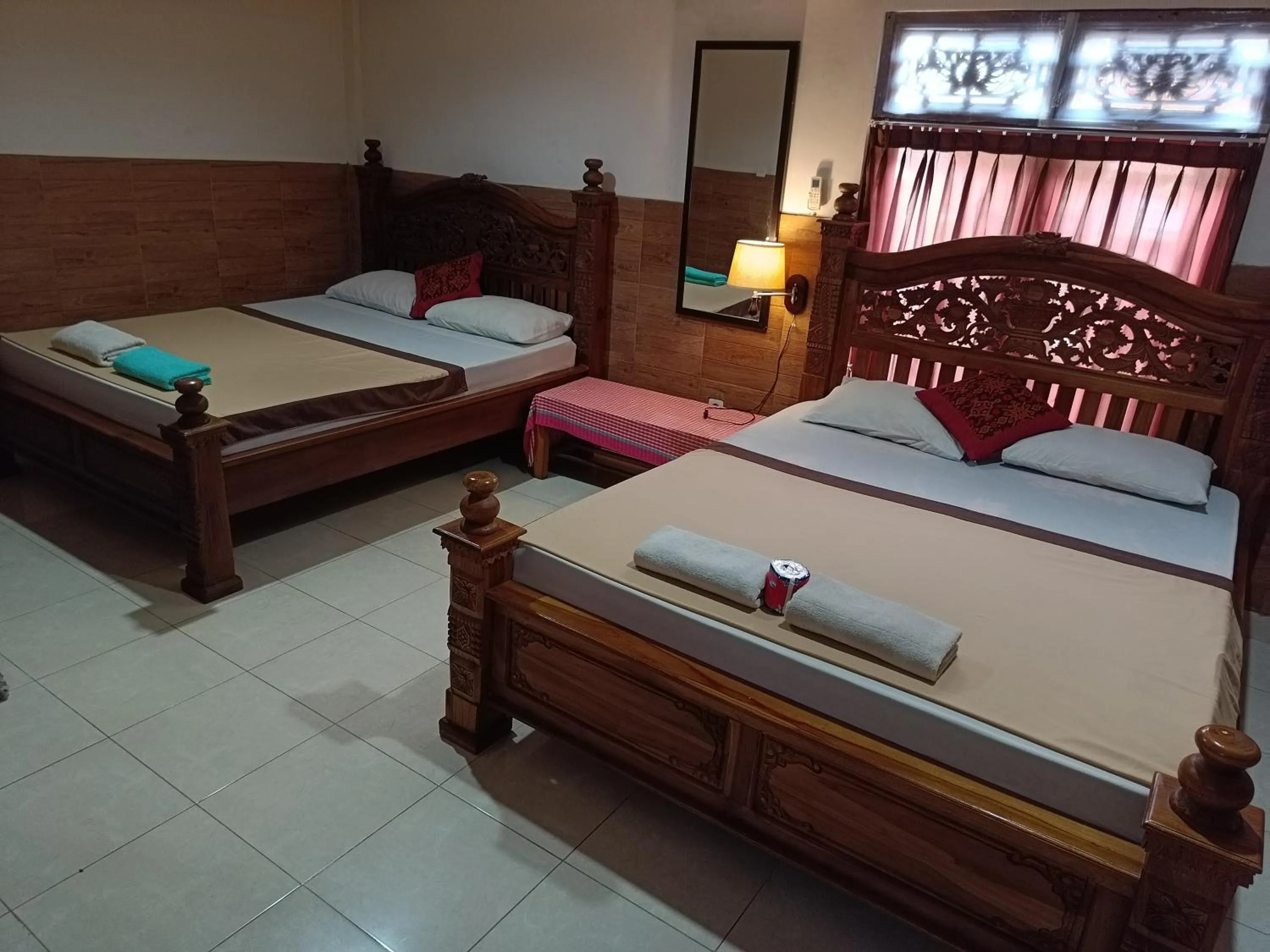 Bed in Nyoman House Ubud