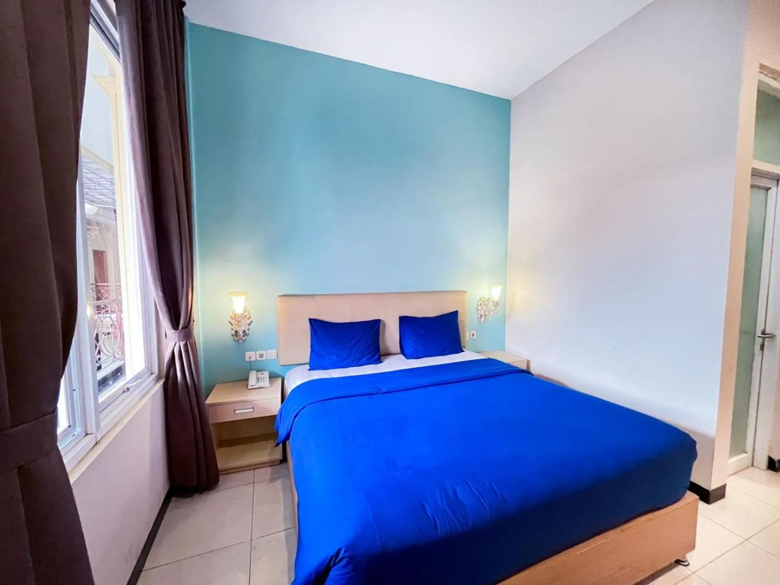 Bed in Ceria Boutique Hotel