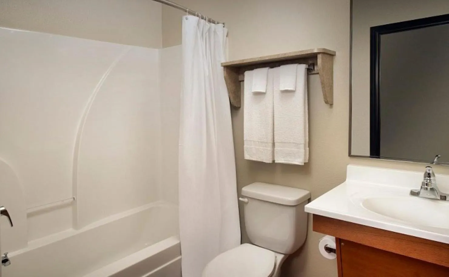 Bathroom in WoodSpring Suites Louisville Jeffersontown