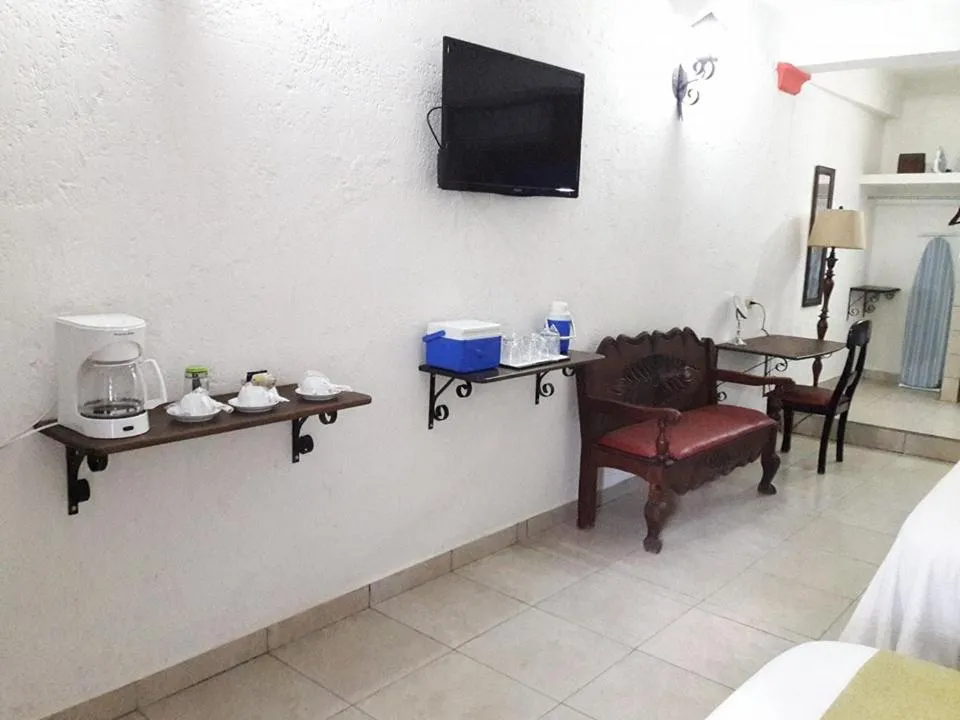 Communal lounge/ TV room, Bed in Hotel Ciudad Blanca