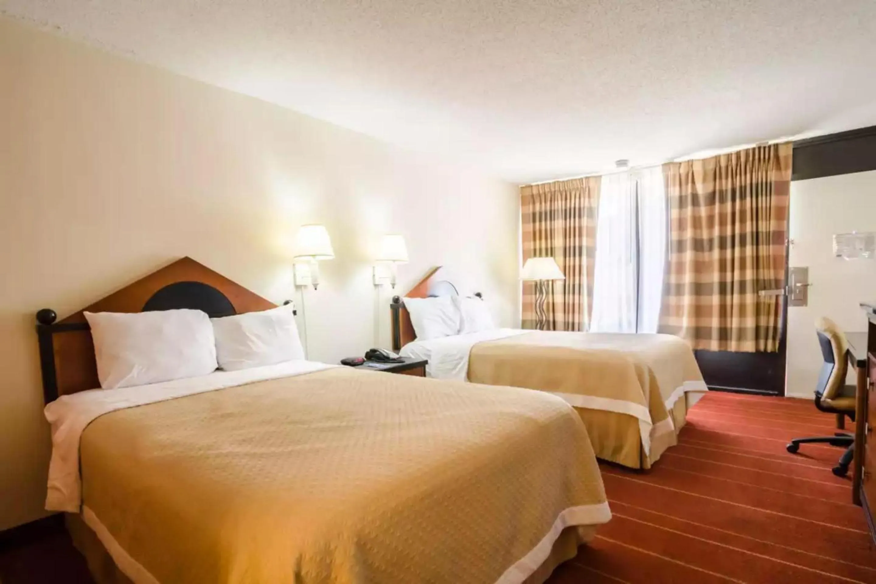 Family Suite - 2 Full Beds & Pull-Out Sofa Non-Smoking in Rodeway Inn & Suites Greensboro Southeast