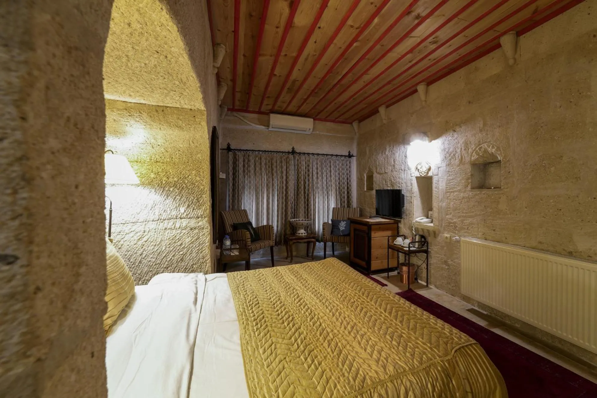 Bed in Tekkaya Cave Hotel