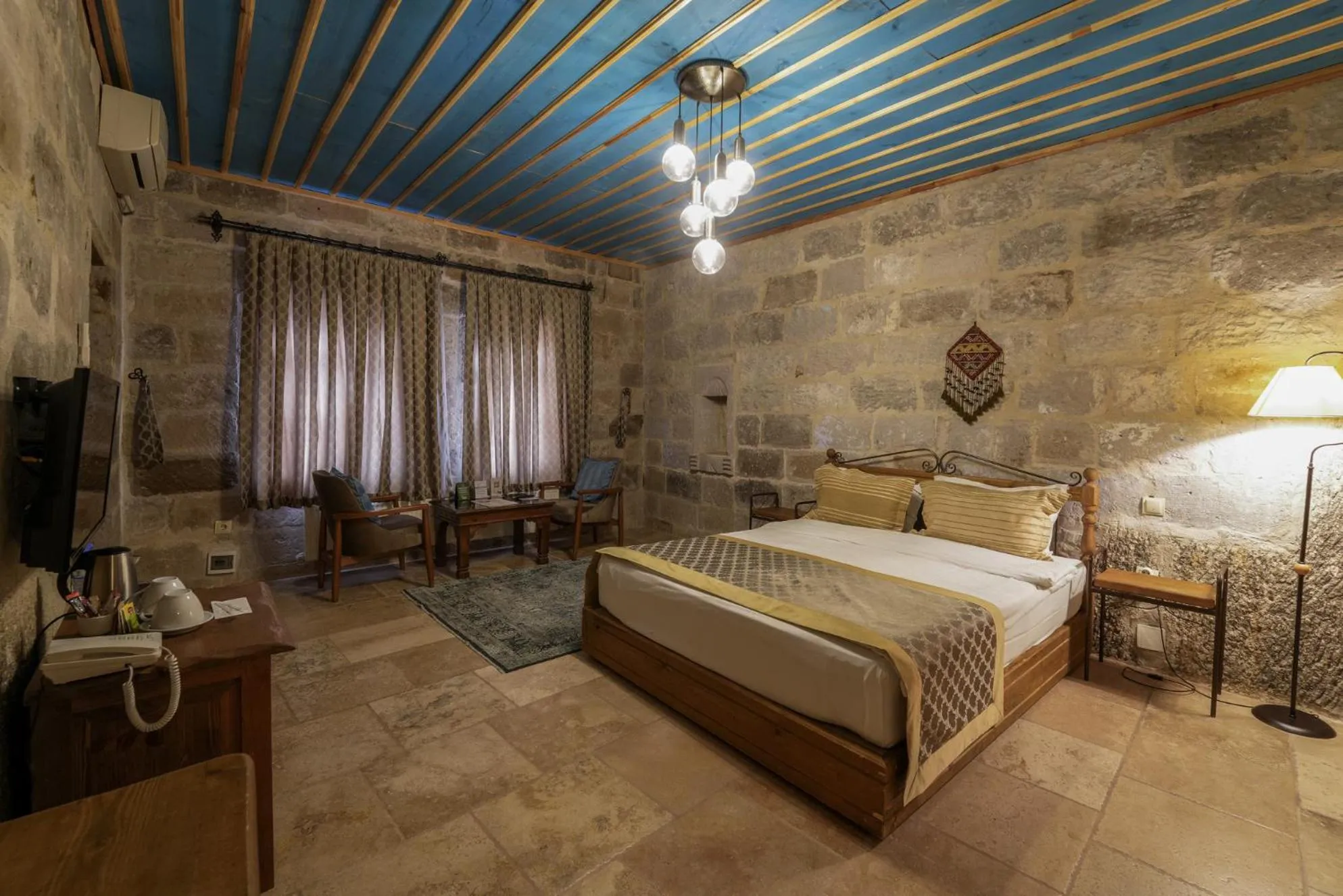 Bed in Tekkaya Cave Hotel