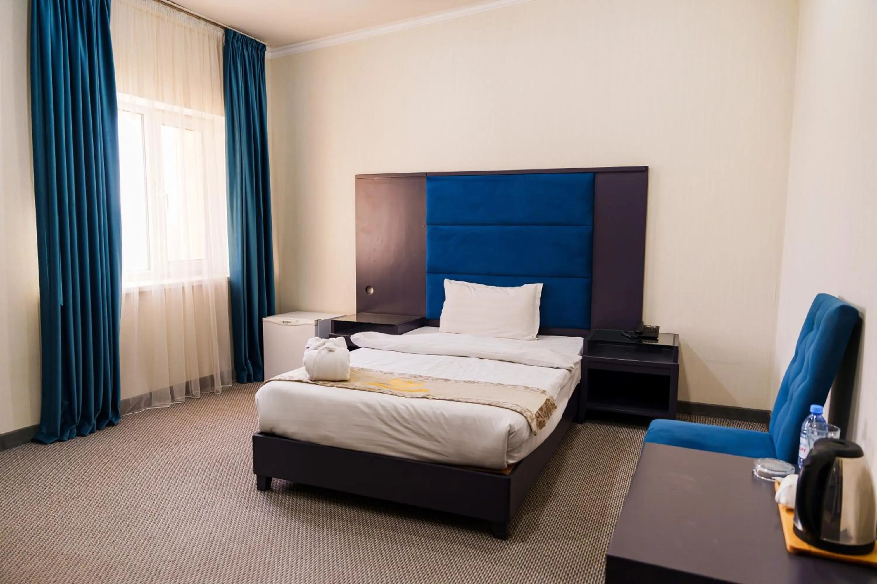 Photo of the whole room, Bed in Almaty Grand Erbil Hotel