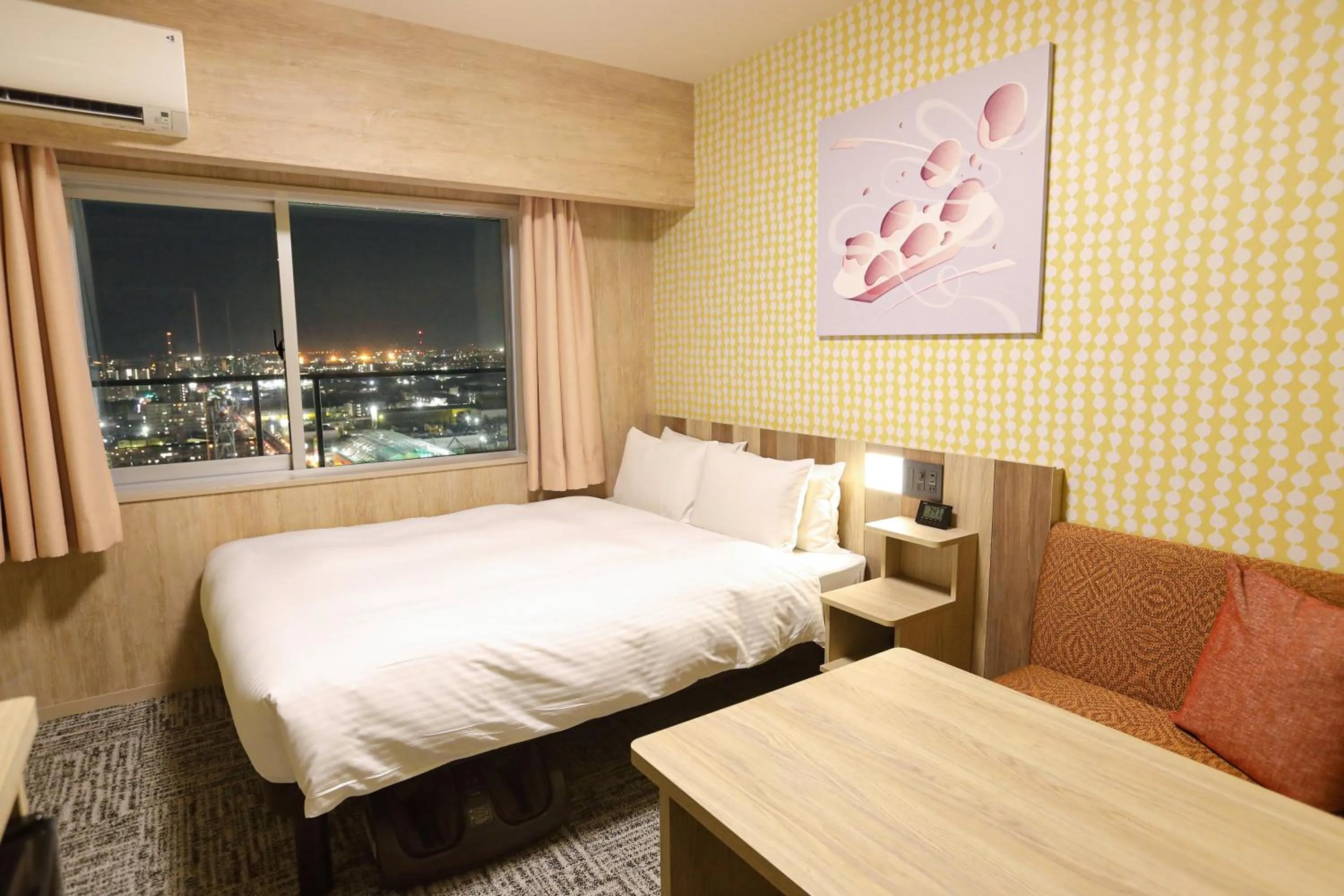 Bed in Hiyori Hotel Osaka Suminoekoen Station