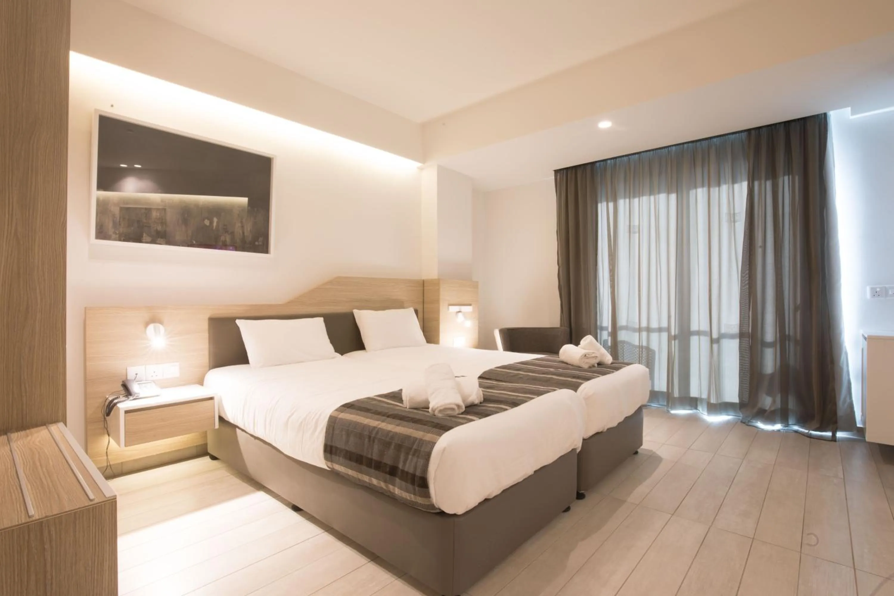 Bed in Evalena Beach Hotel