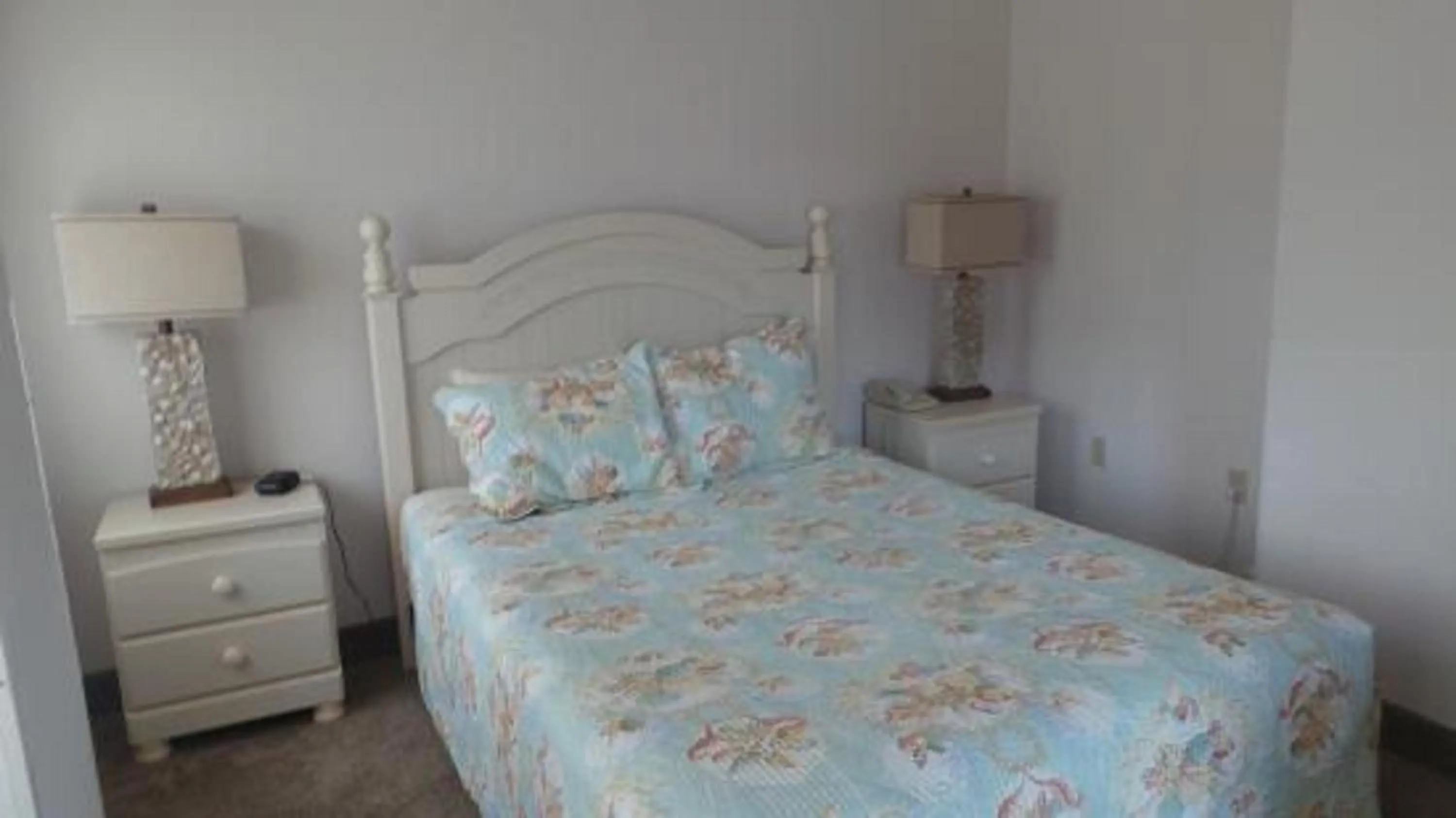 Bed in Watson's Regency Suites