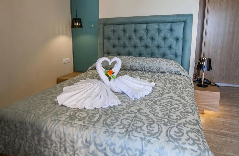 Bed in Paradise Lost Hotel-Apartments