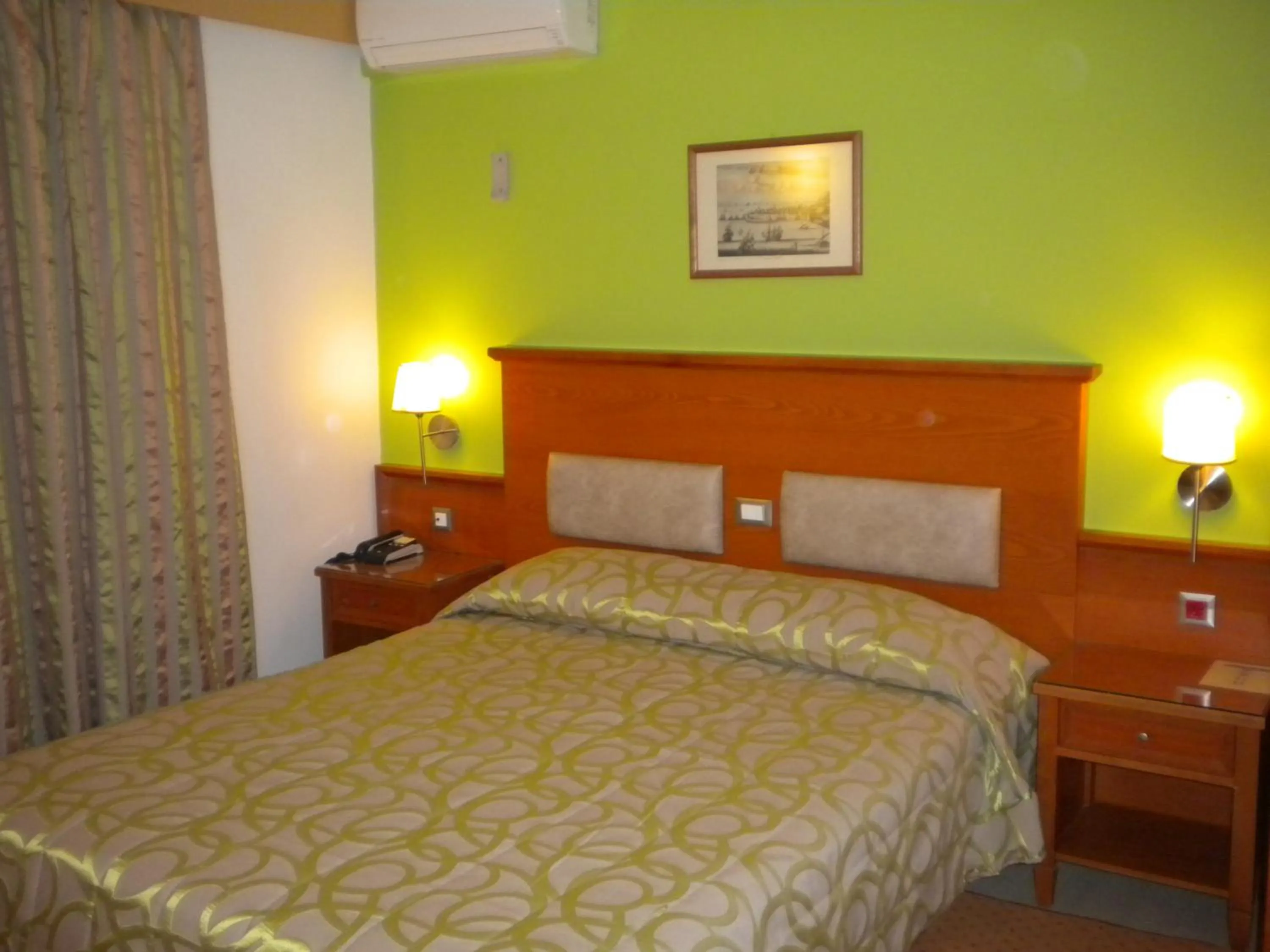 Bed in Paradise Lost Hotel-Apartments