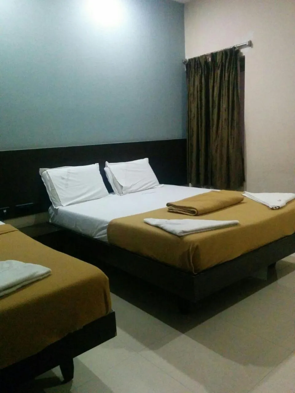 Bed in Vijey Hotels