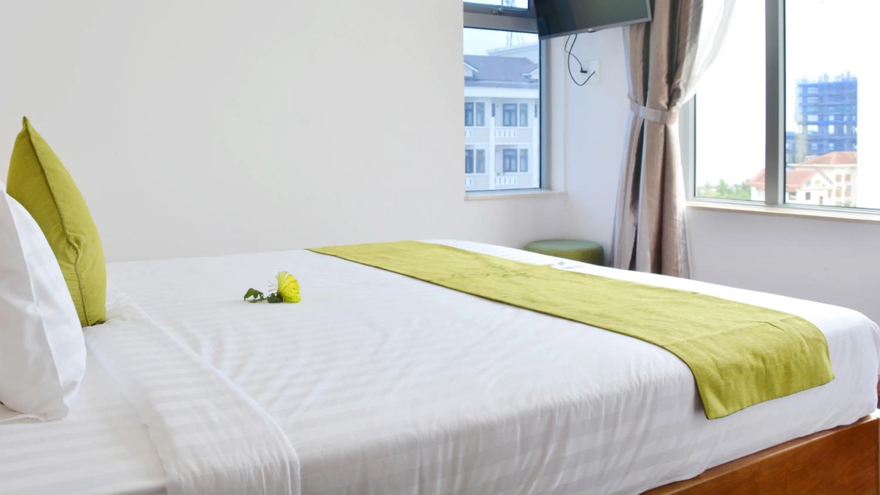 Bed in Richico Apartments And Hotel