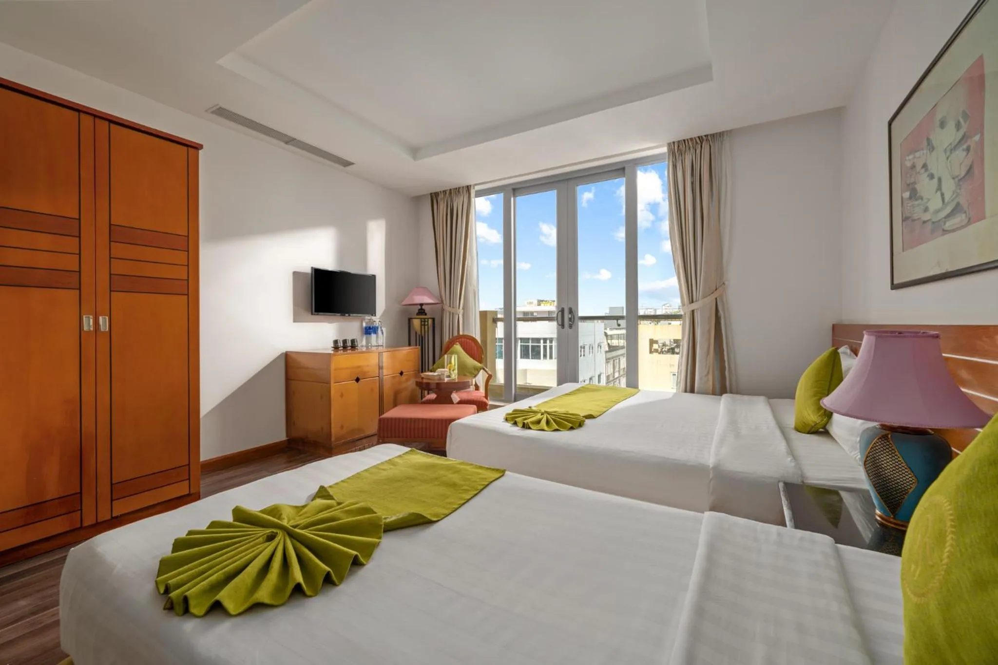 Bed in Richico Apartments And Hotel