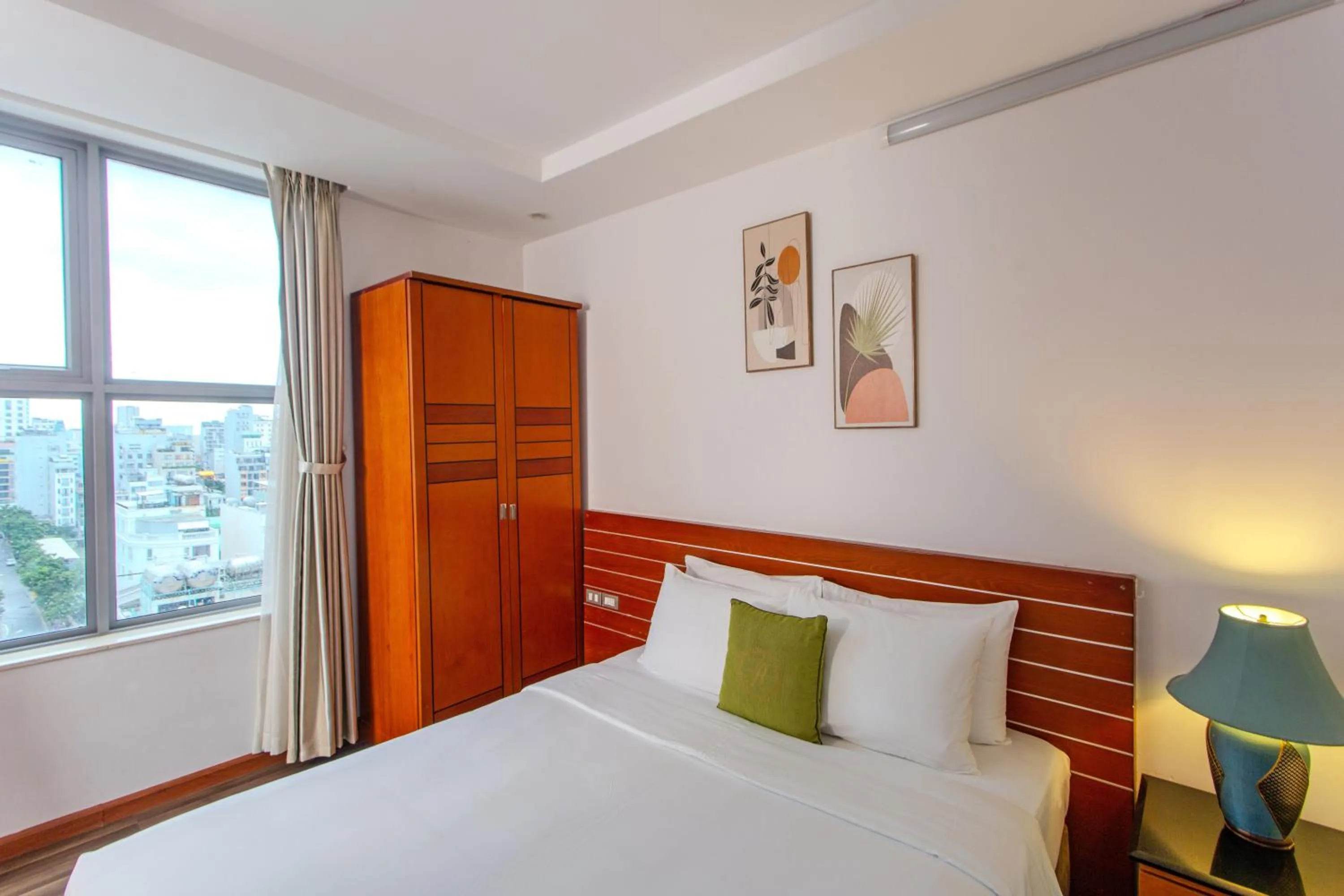 Bed in Richico Apartments And Hotel