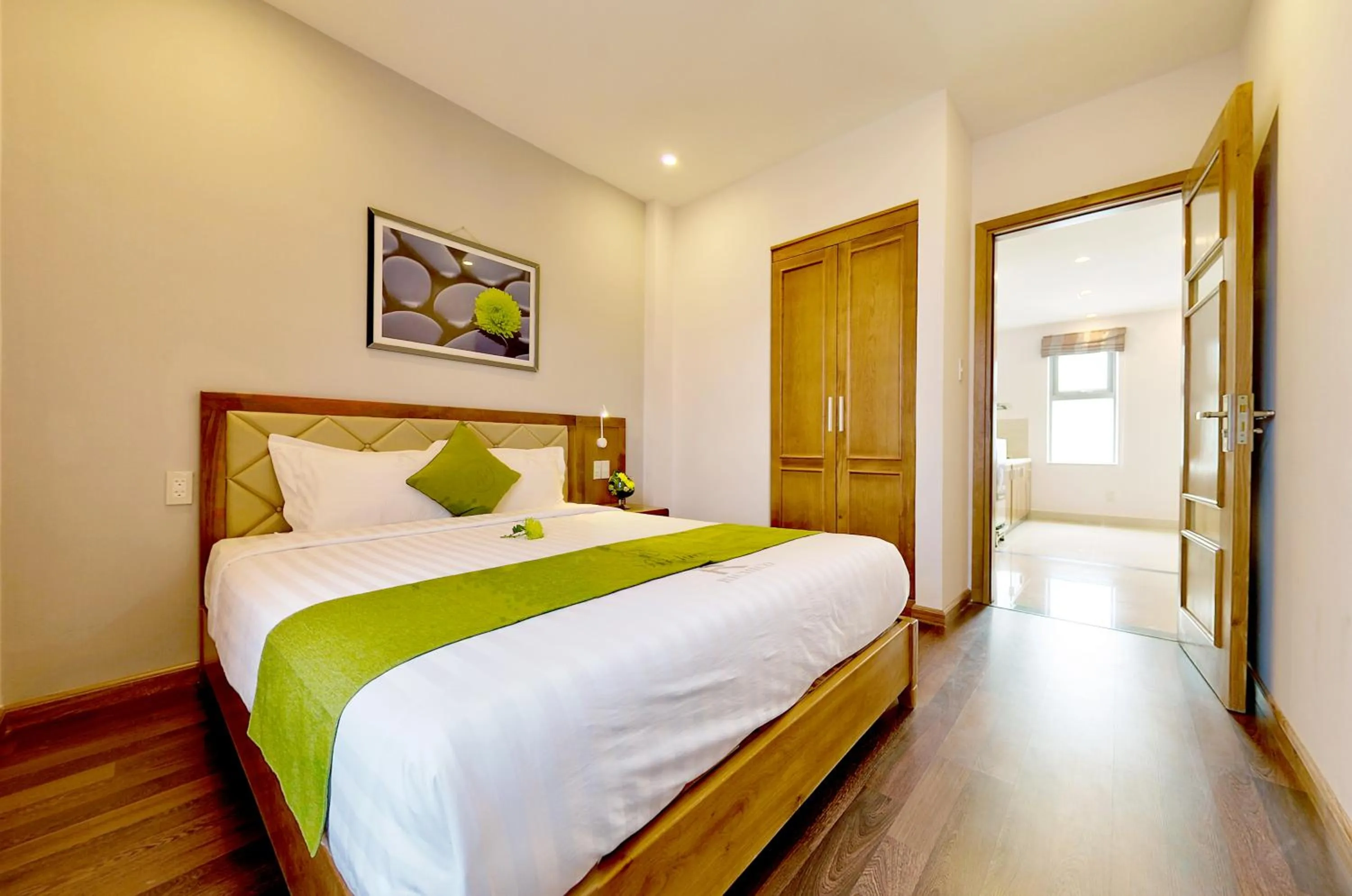 Bed in Richico Apartments And Hotel