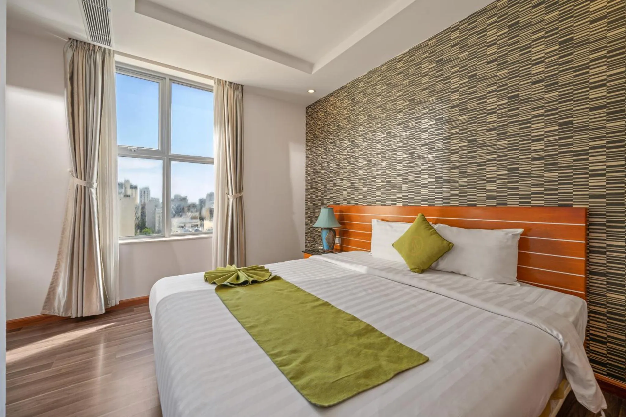 Bed in Richico Apartments And Hotel