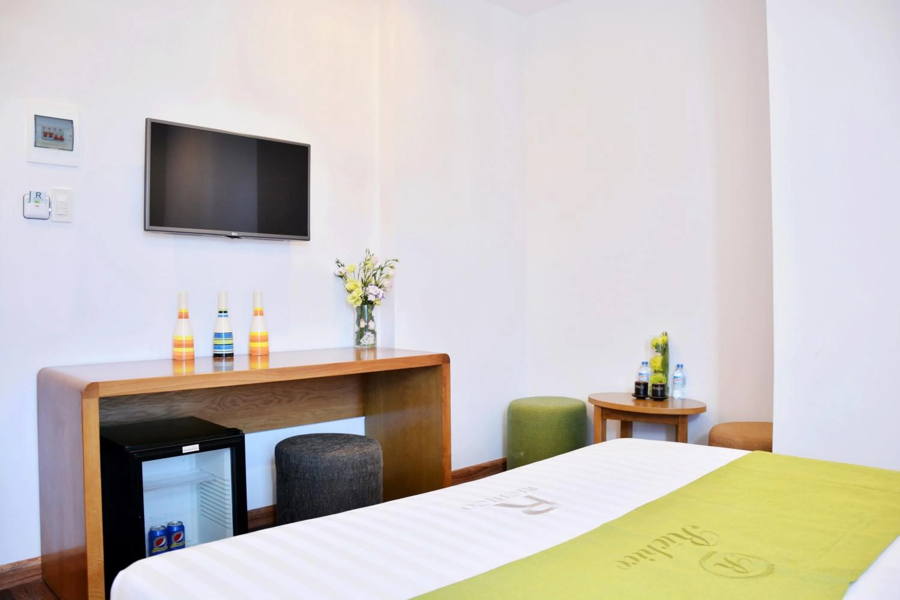 Bed in Richico Apartments And Hotel