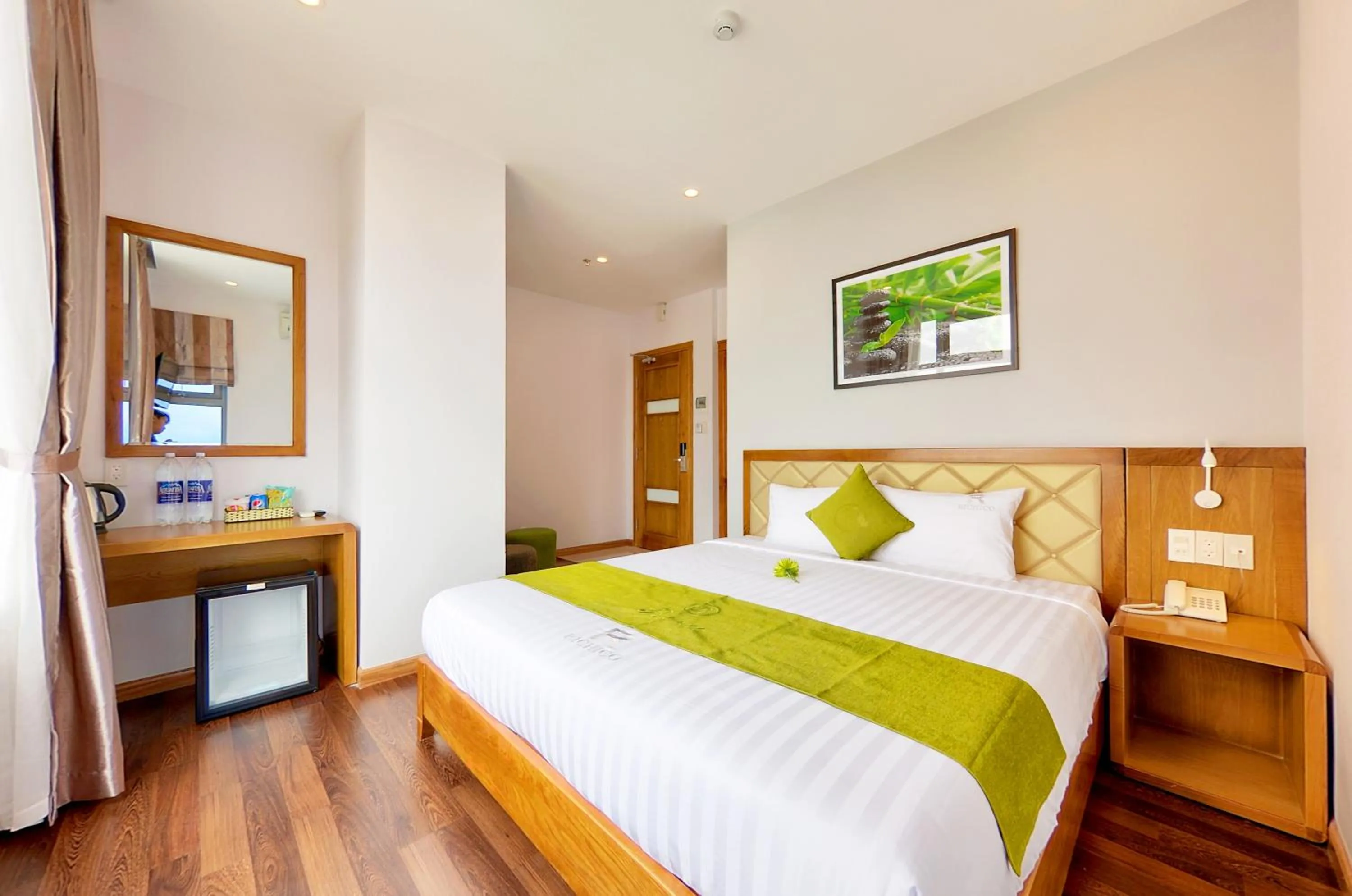 Bed in Richico Apartments And Hotel