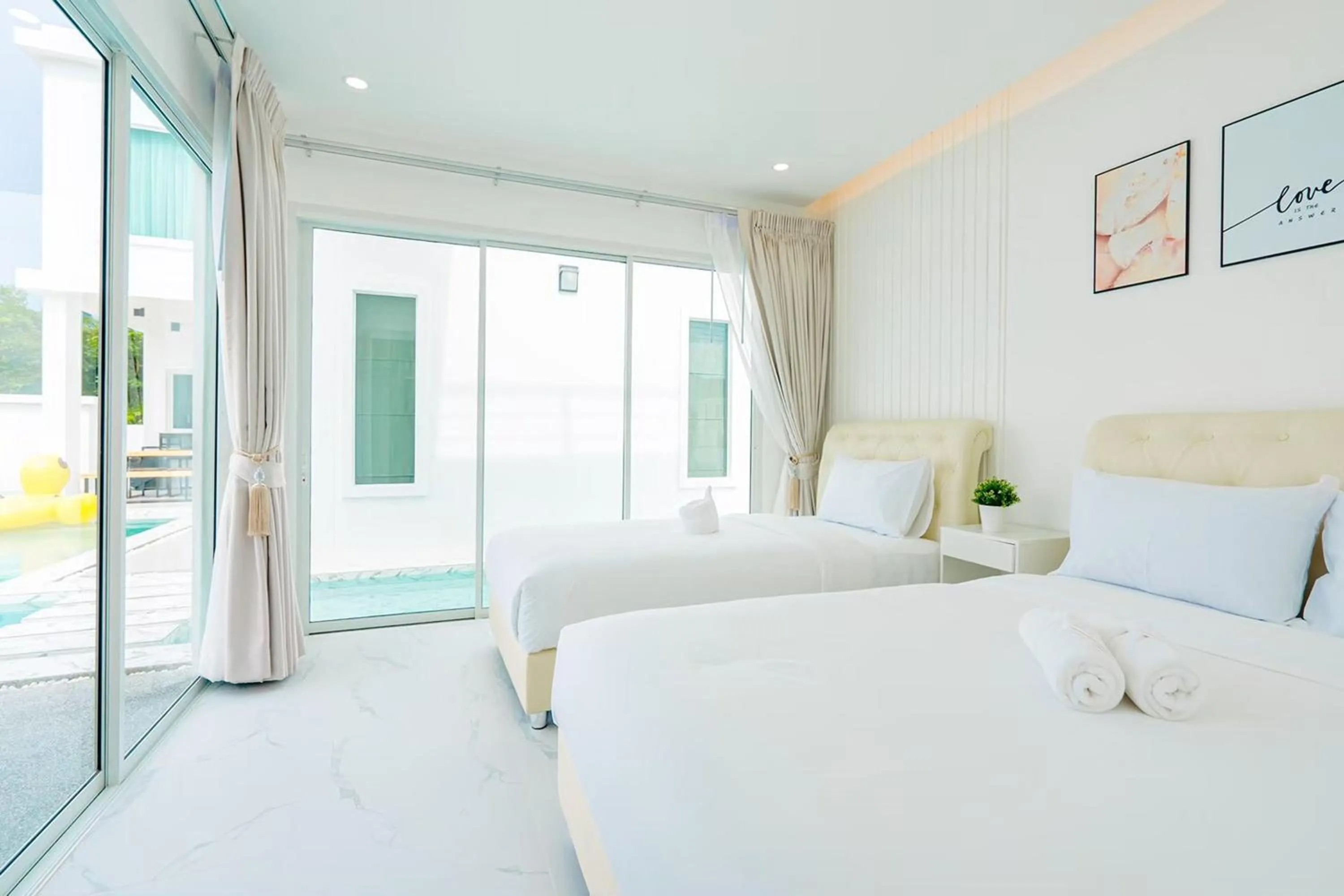 Bed in The Modern Pool Villa Hua Hin