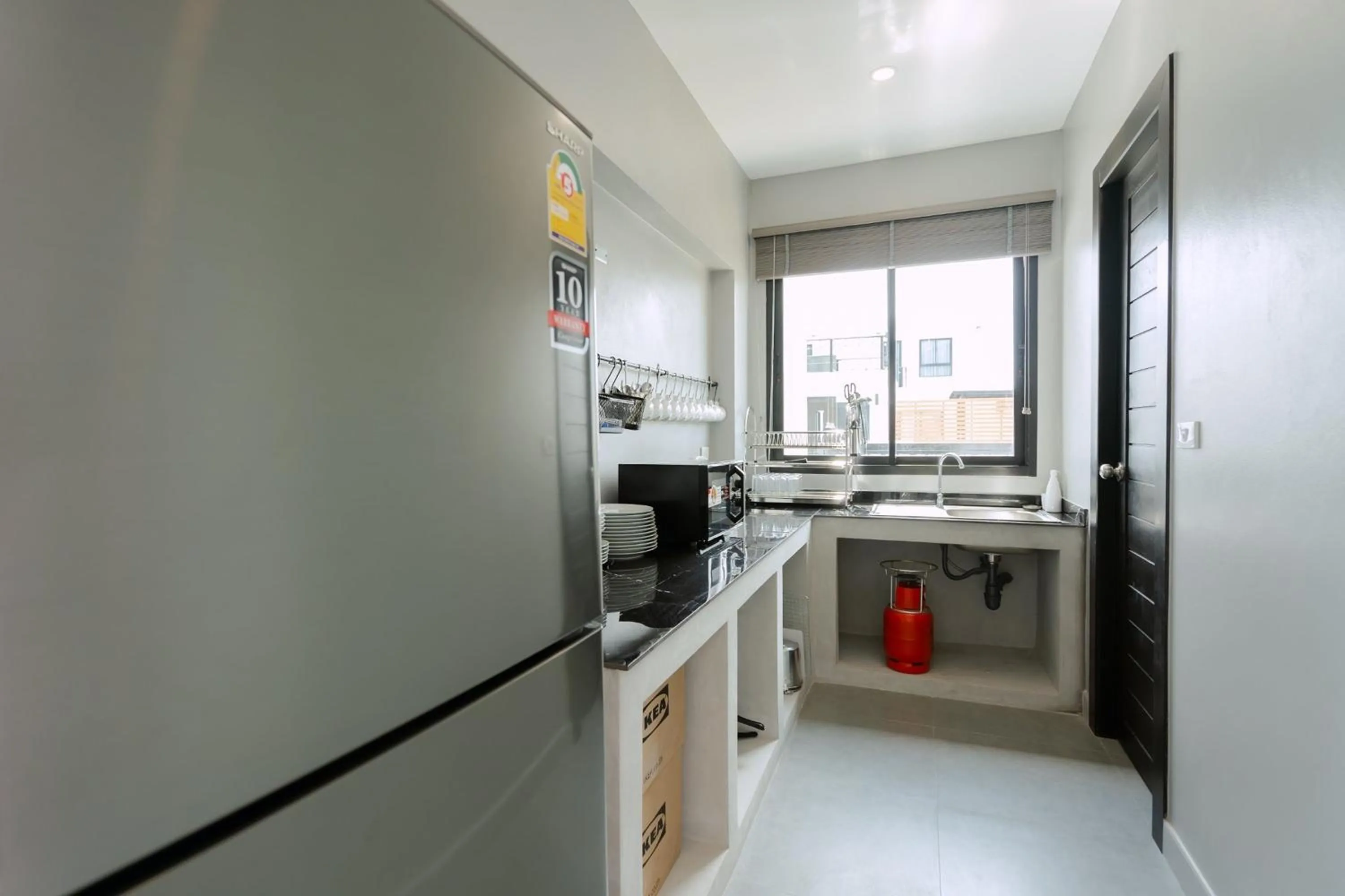 Kitchen or kitchenette in The Modern Pool Villa Hua Hin