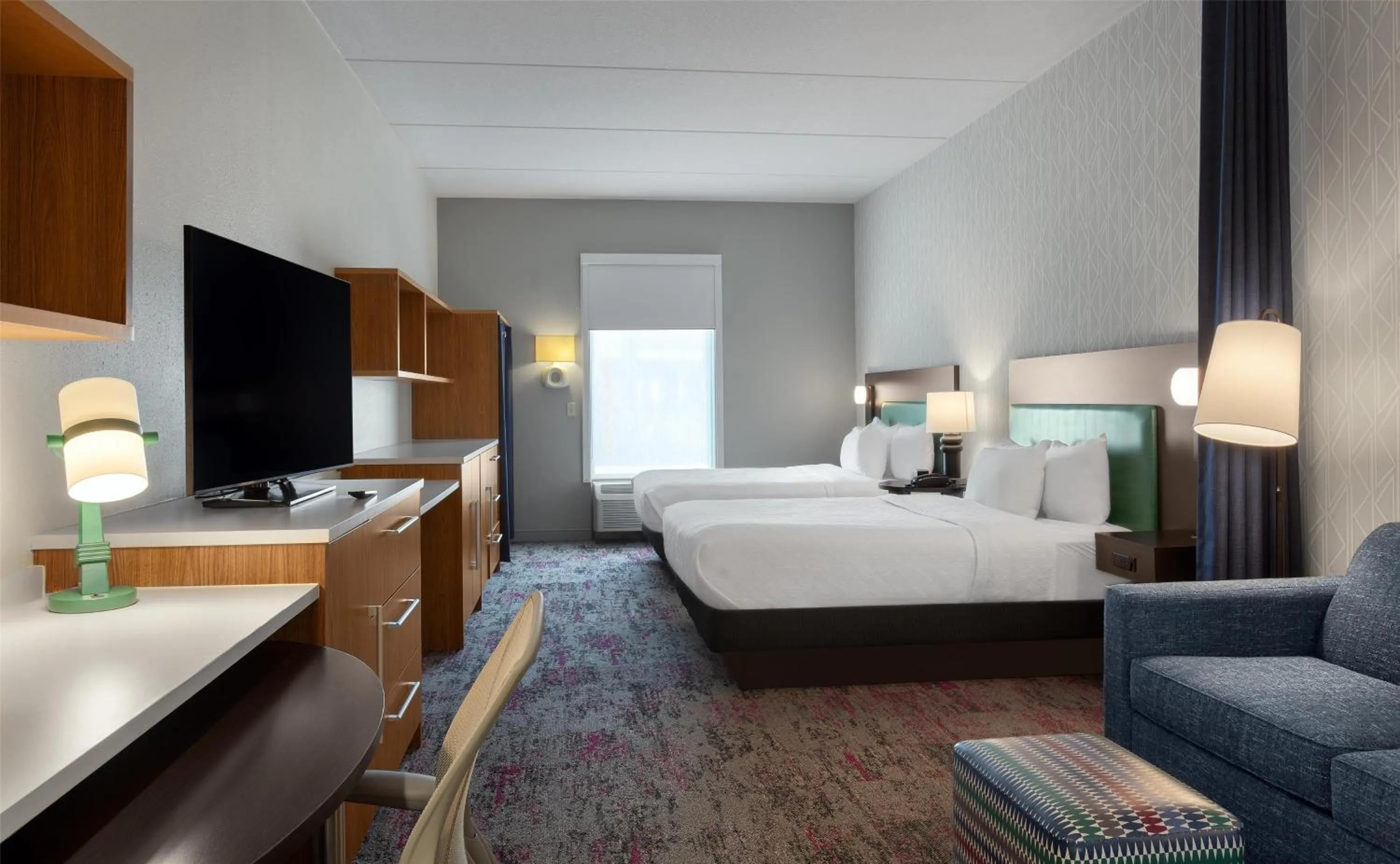 Living room, Bed in Home2 Suites by Hilton Greenville Airport