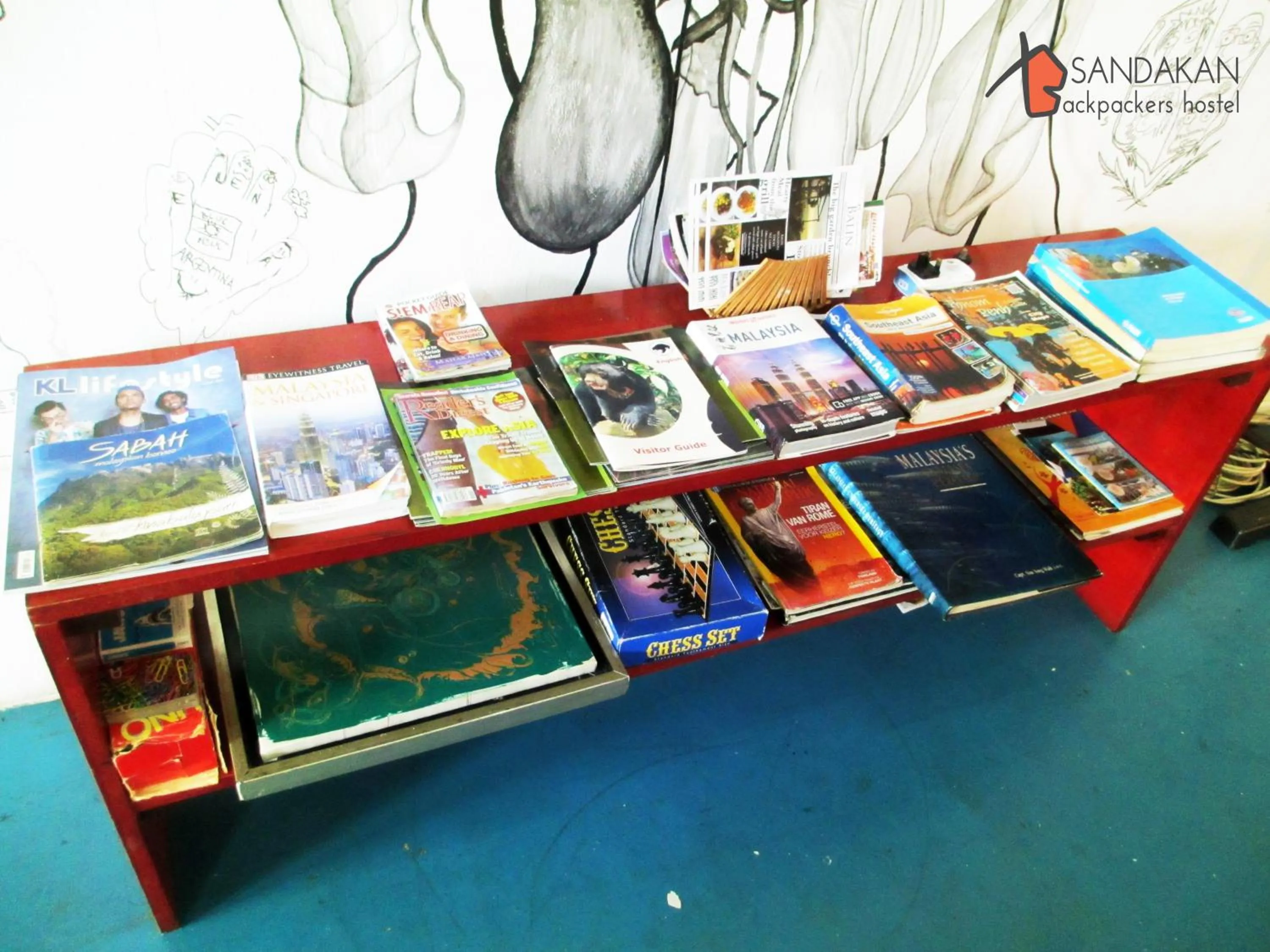 Communal lounge/ TV room in Sandakan Backpackers Hostel