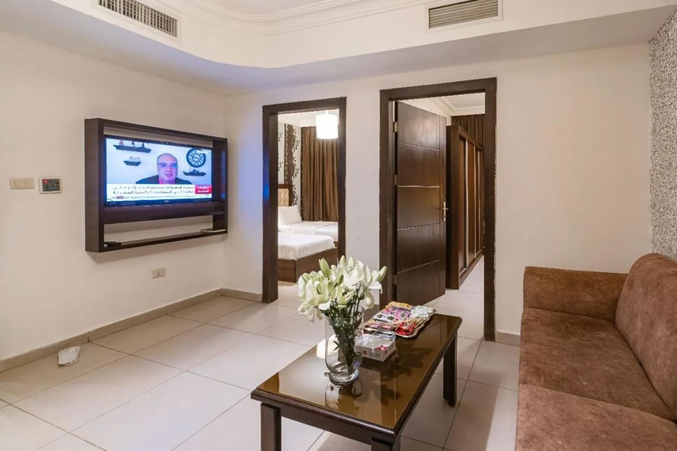 Communal lounge/ TV room in Lancaster Hotel Apartments-Gardens