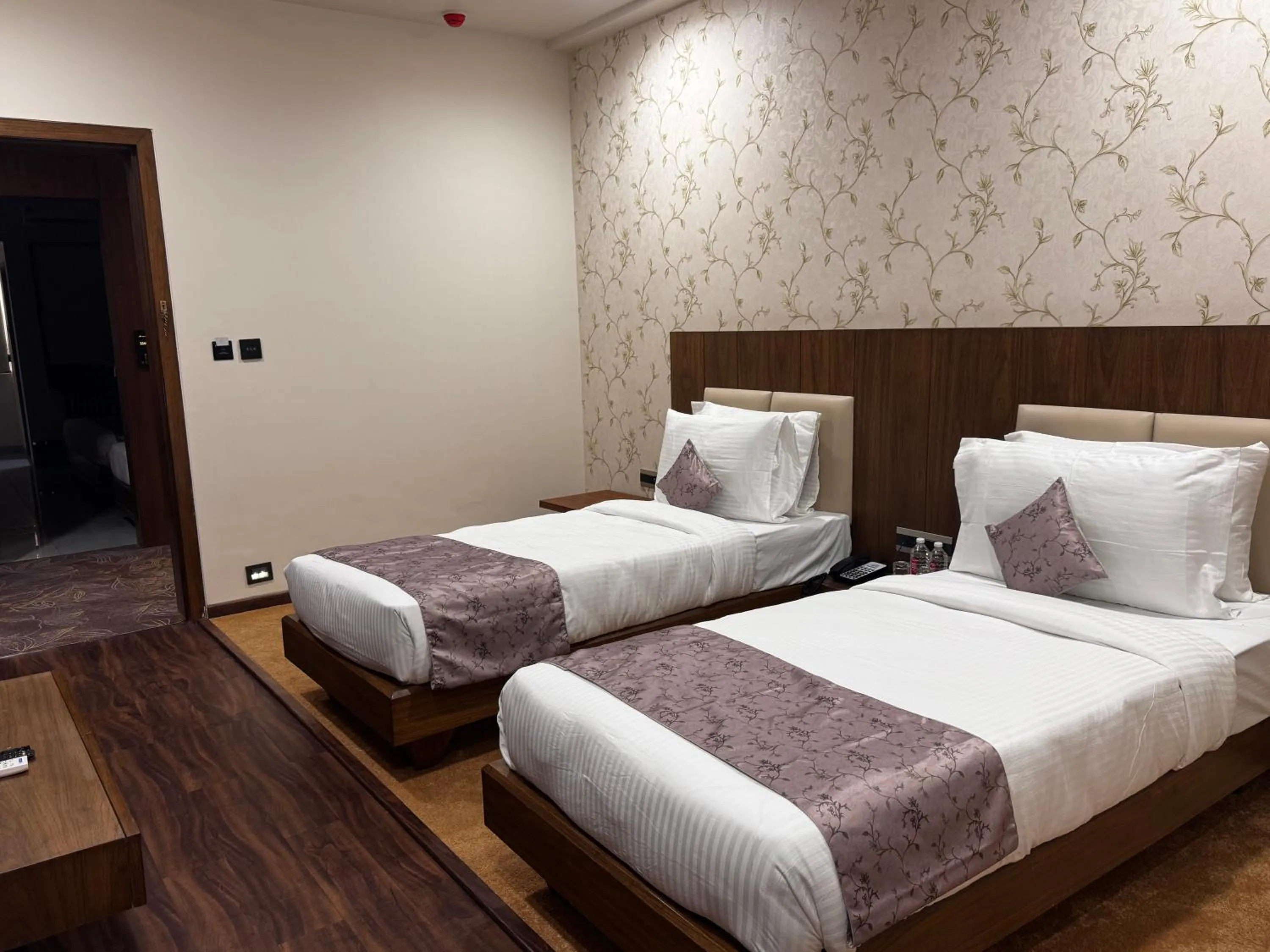 Bed in Pam Premium Hotel Vadodara