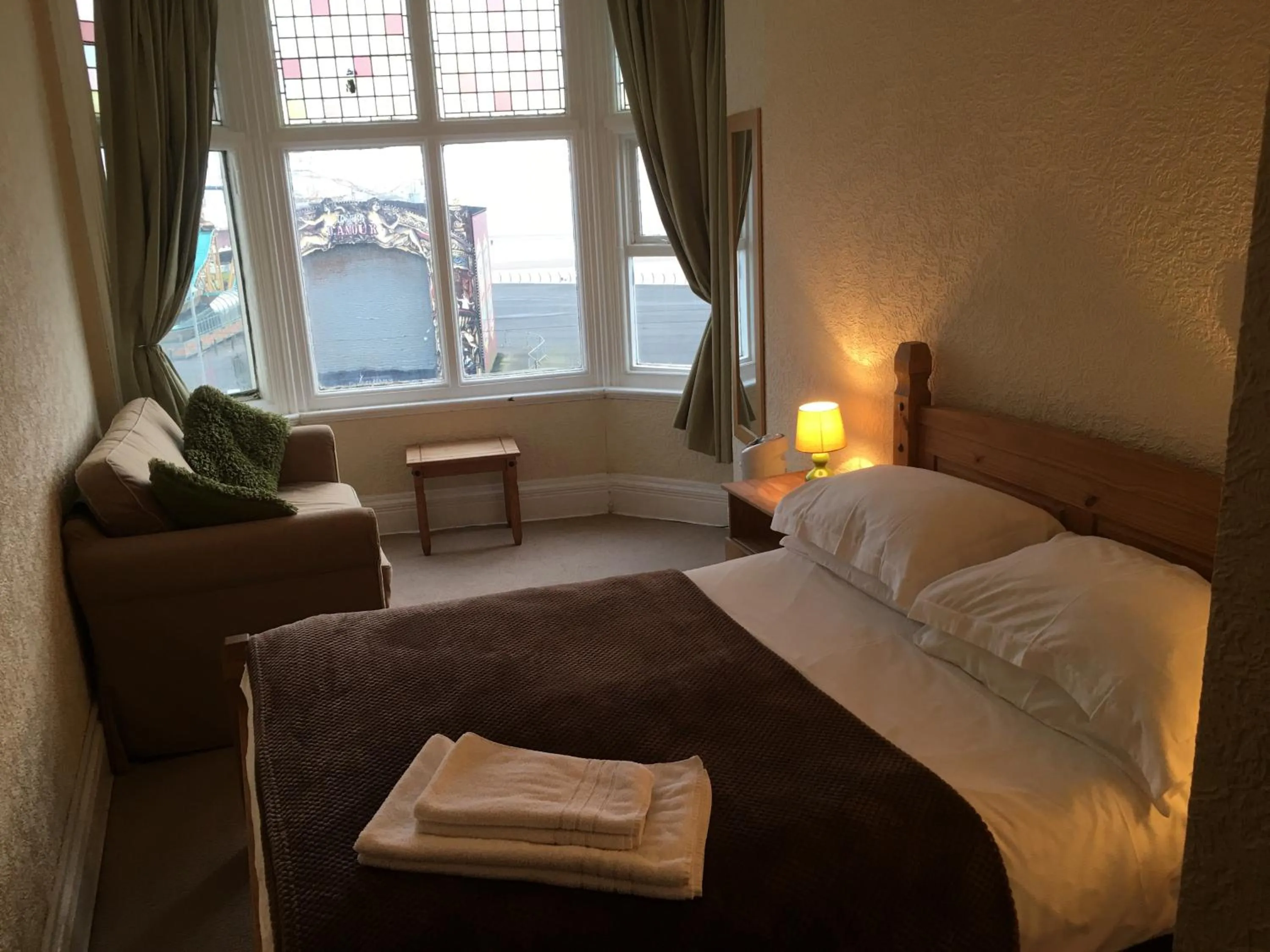 Bed in Camelot Seafront Hotel