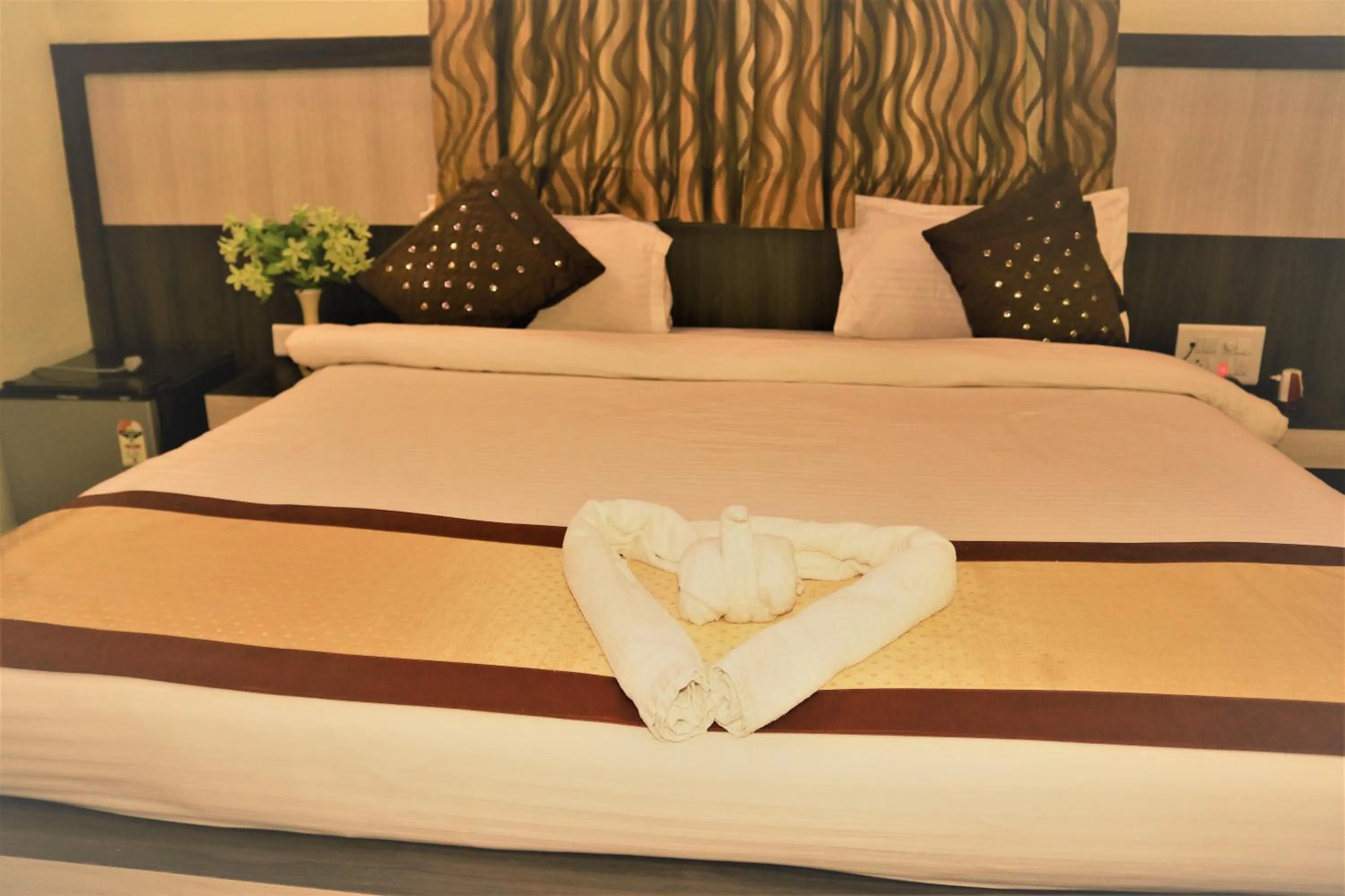 Bed in Hotel Vaishnavi Heights