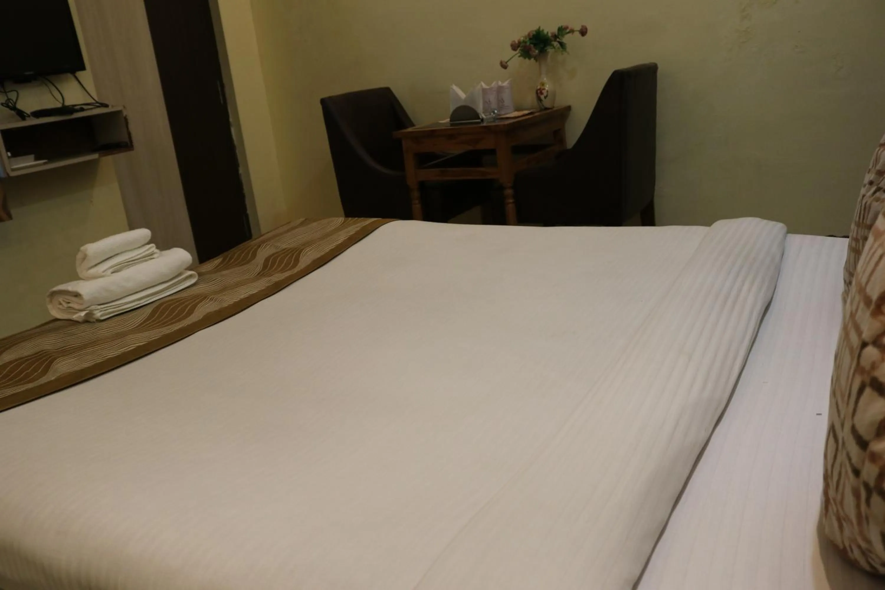 Bed in Hotel Vaishnavi Heights