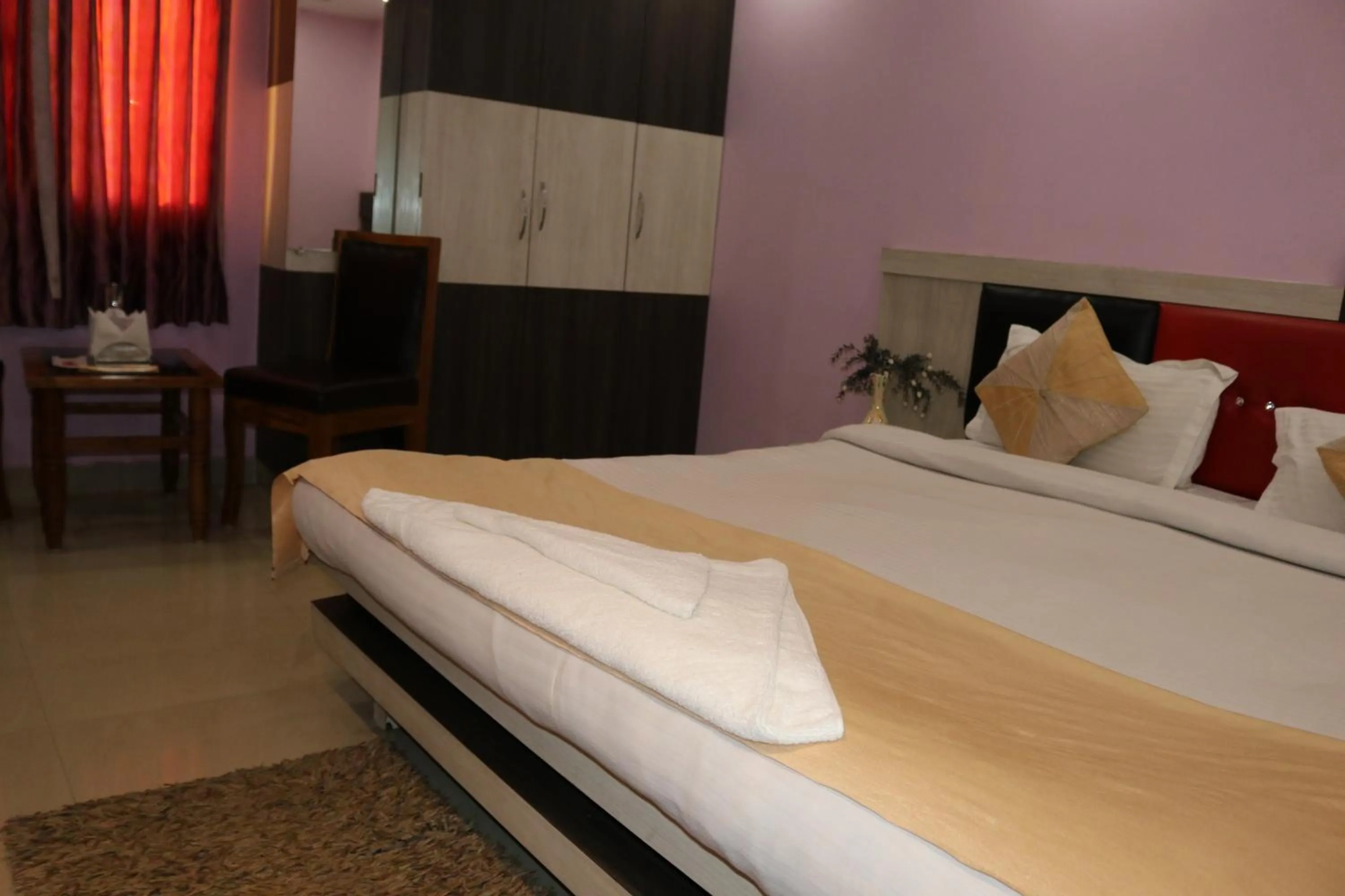 Bed in Hotel Vaishnavi Heights