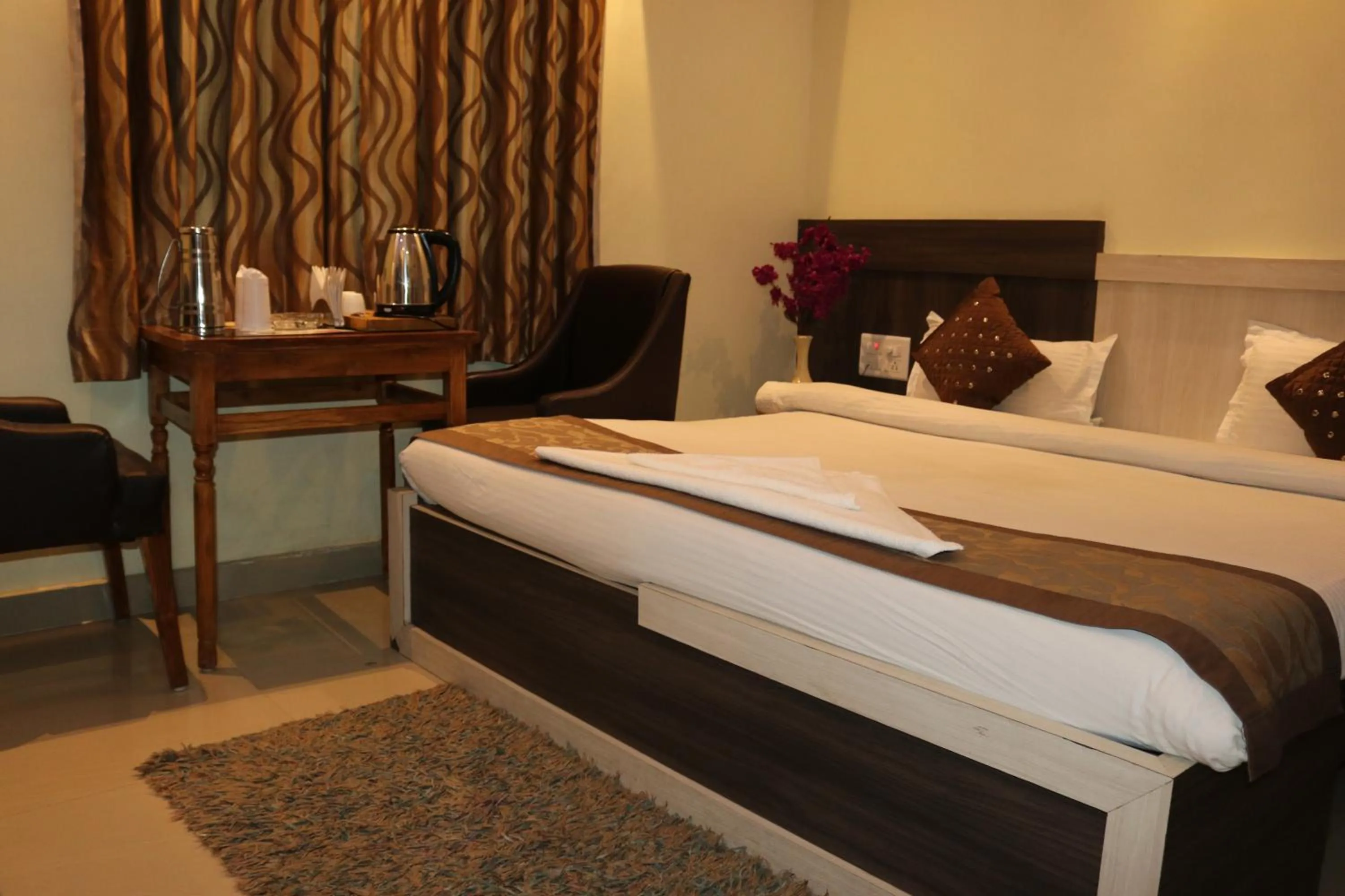 Bed in Hotel Vaishnavi Heights
