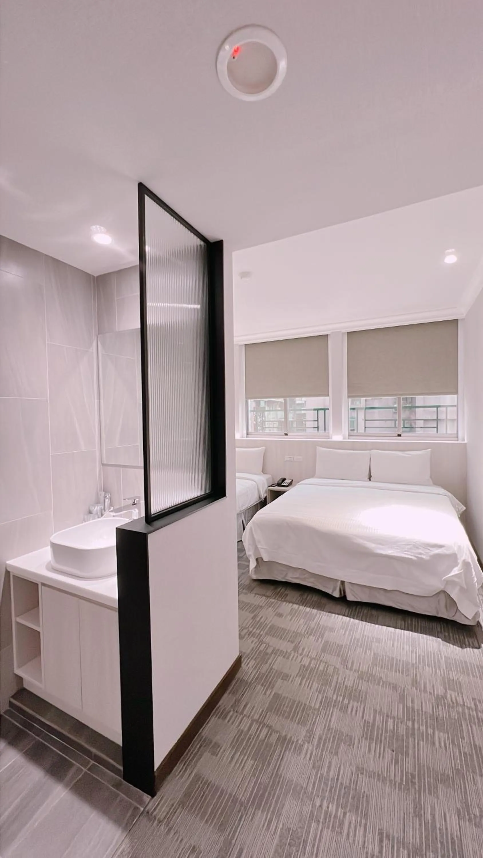 Bathroom, Bed in East Dragon Hotel