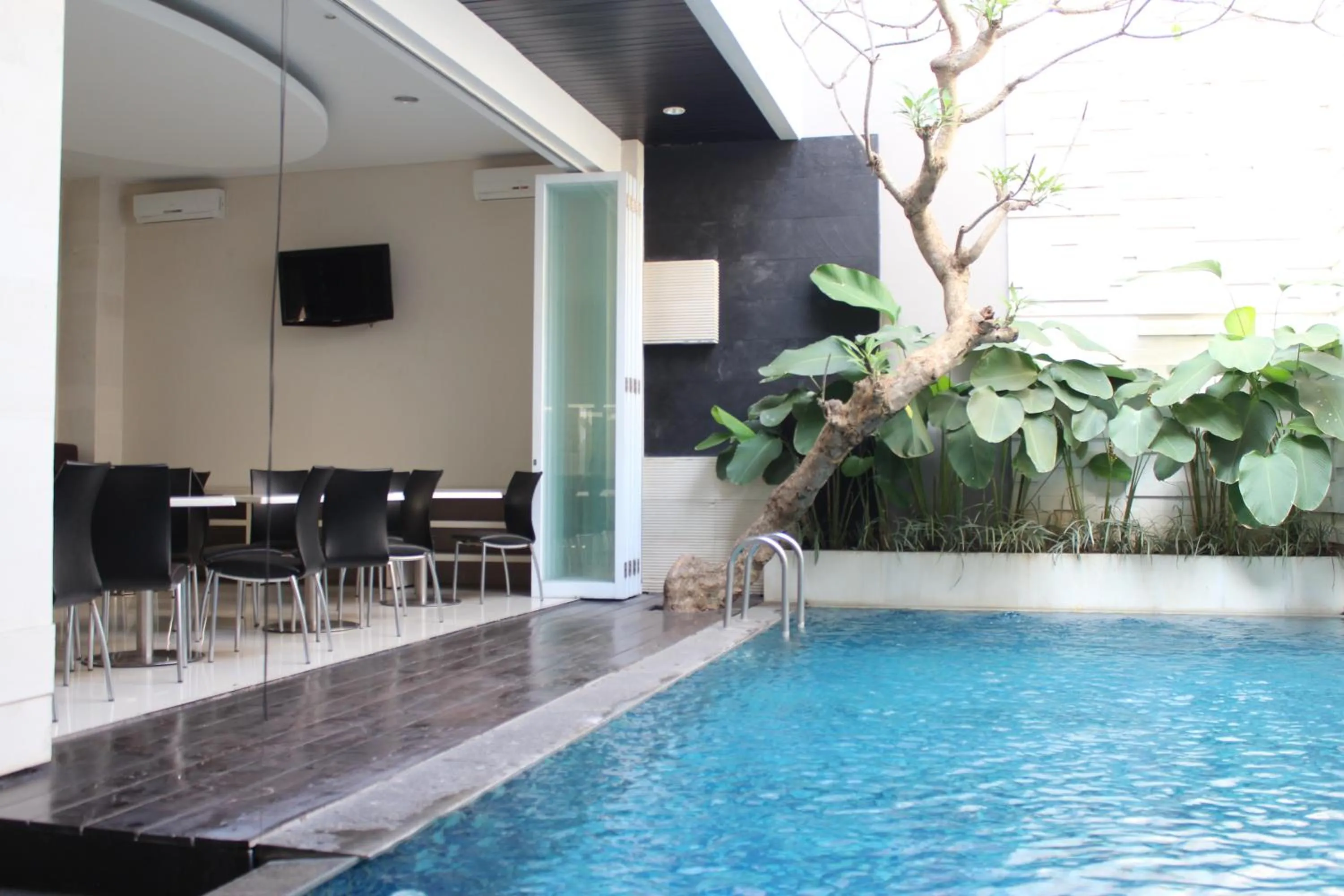 Swimming pool in InKuta Residence and Villa