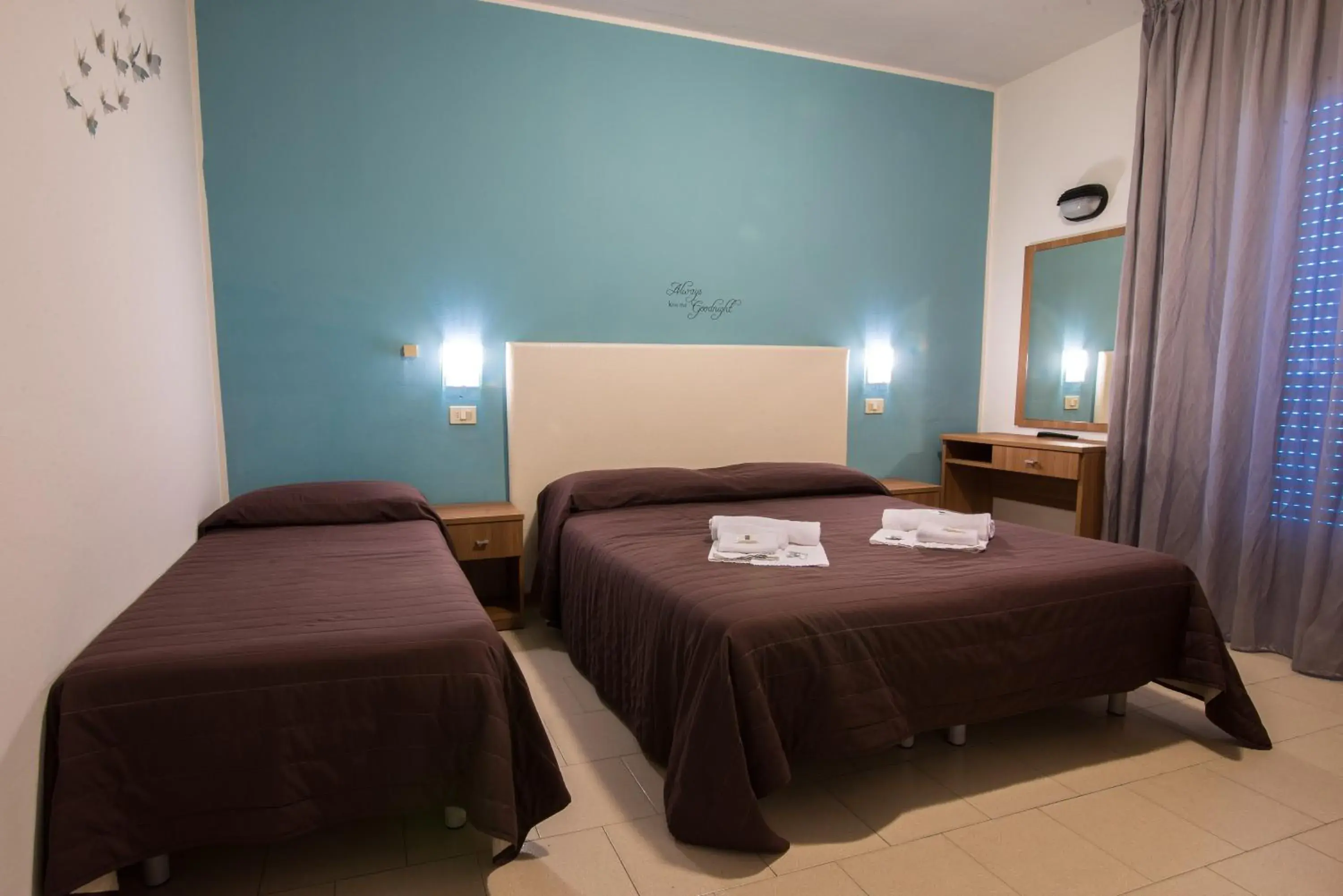 Triple Room in Hotel Vela D'Oro Triple Room in Hotel Vela D'Oro