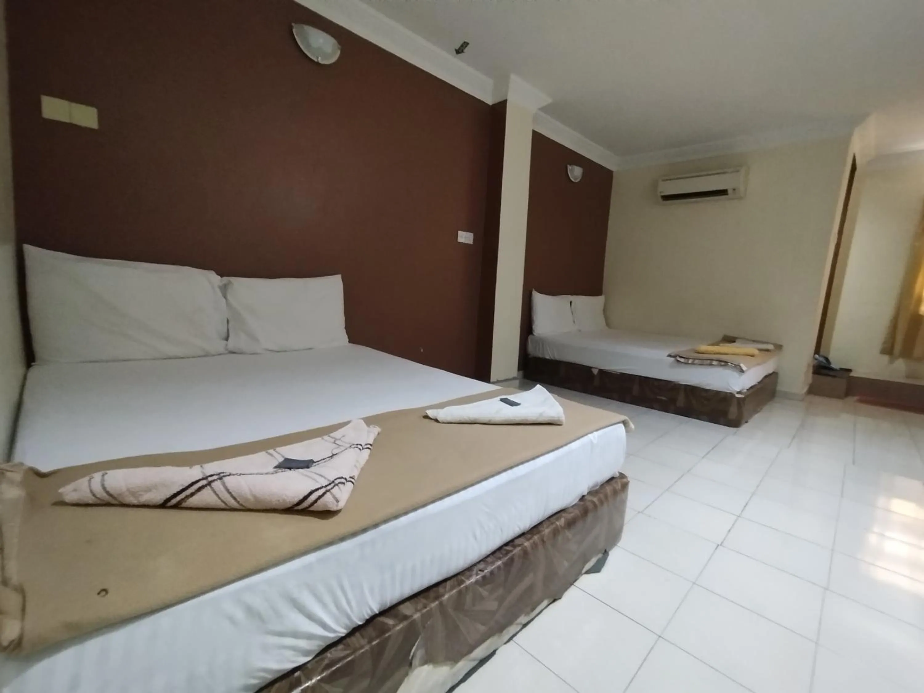 Bed in Sentosa Villa Hotel