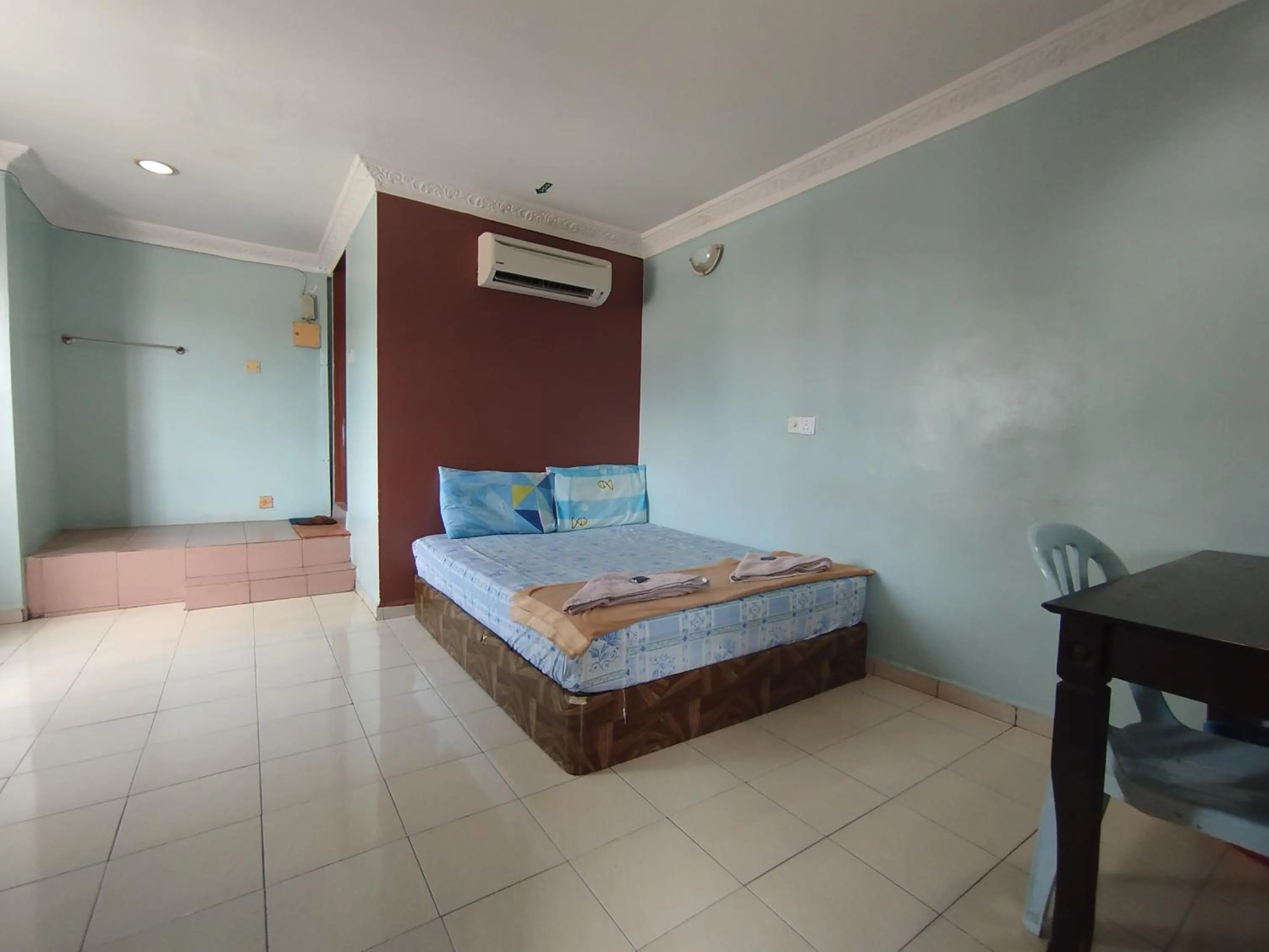 Bed in Sentosa Villa Hotel