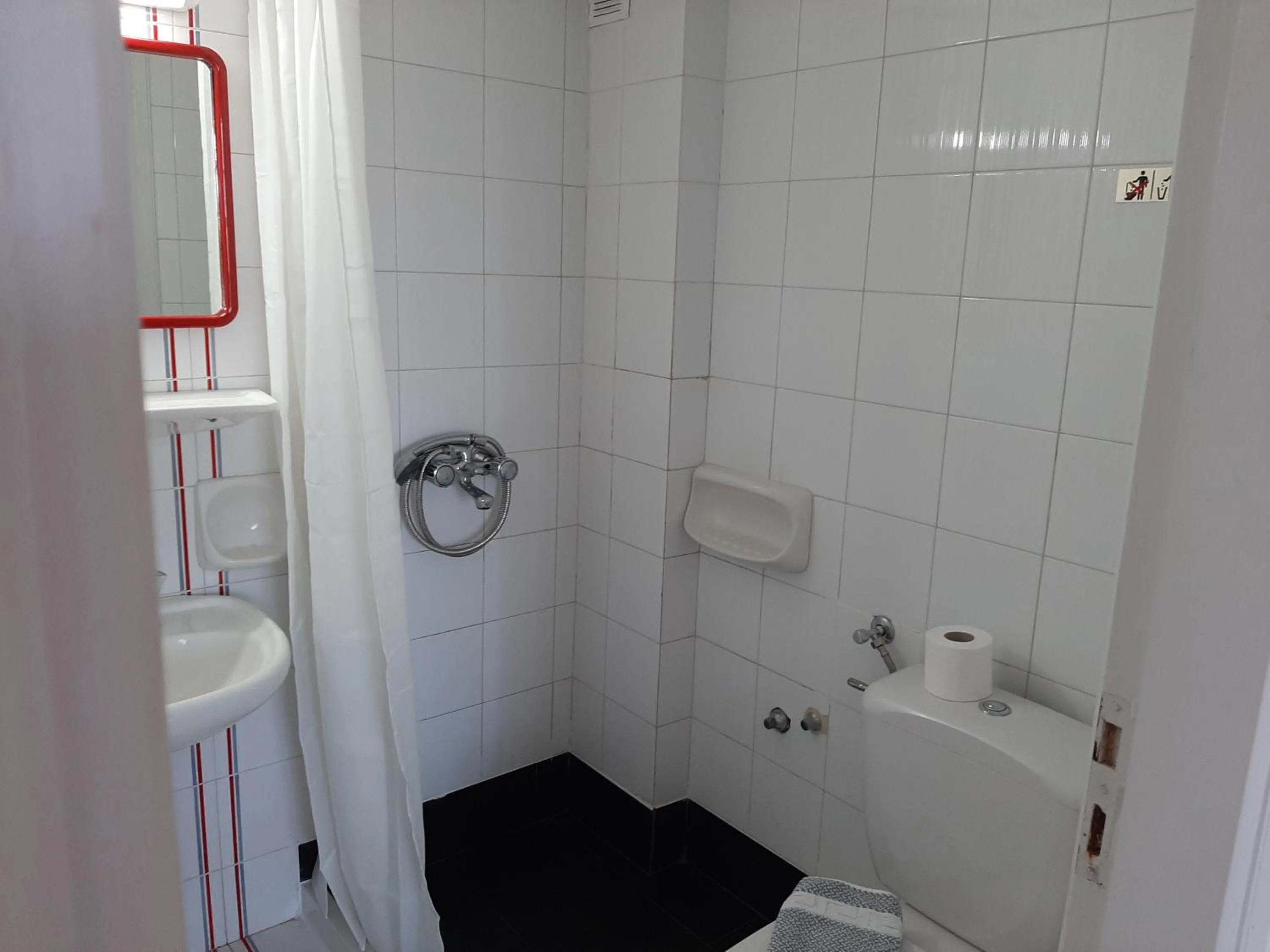 Bathroom in Remi Apartments