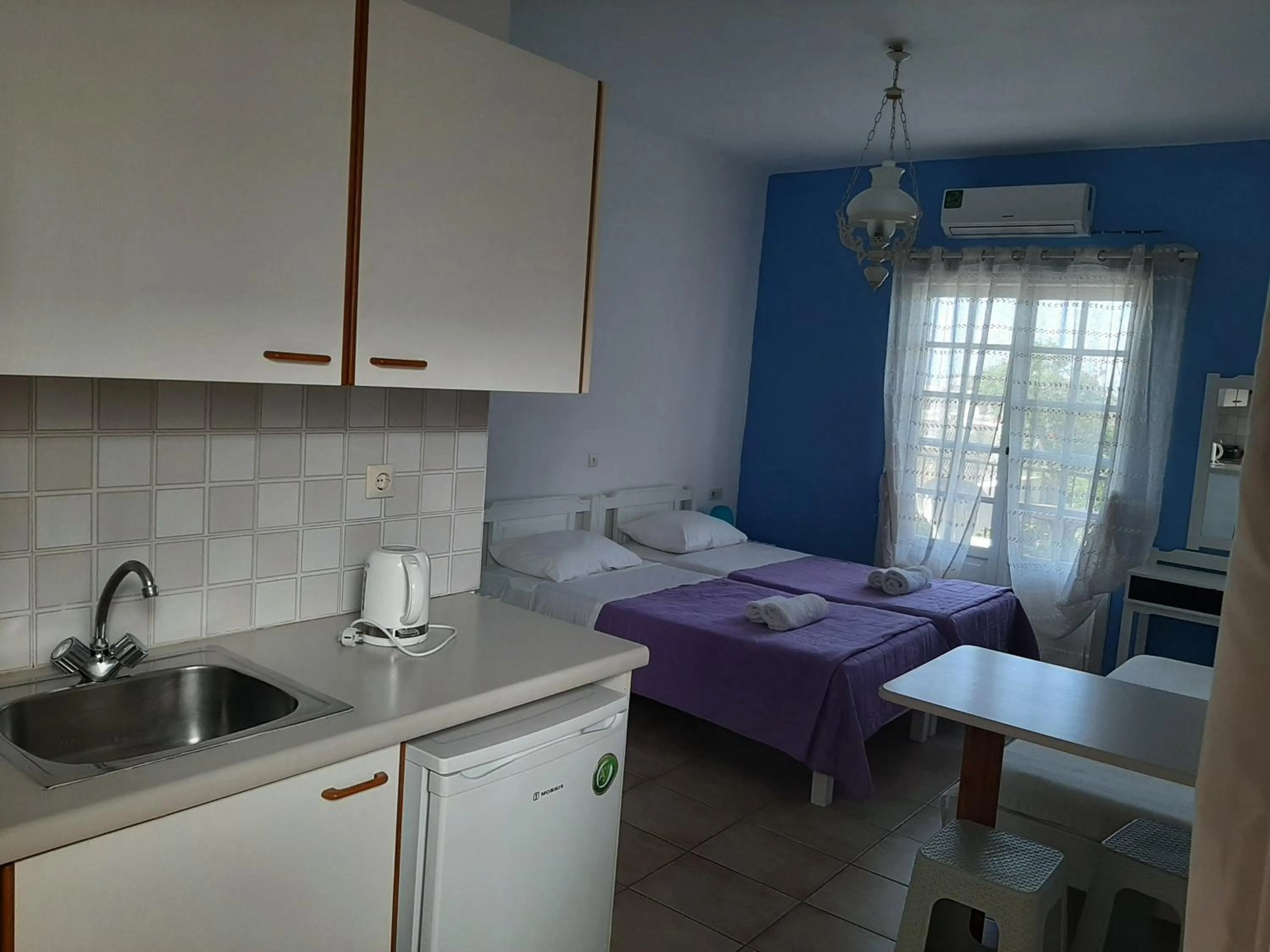 Kitchen or kitchenette in Remi Apartments