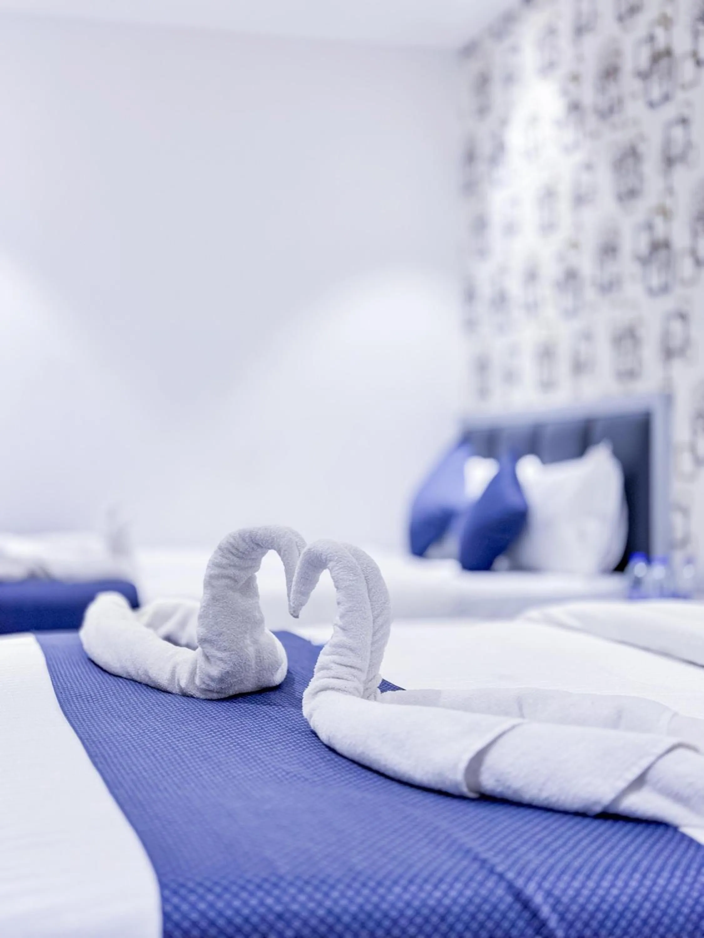 Bed in Hotel Flora Inn