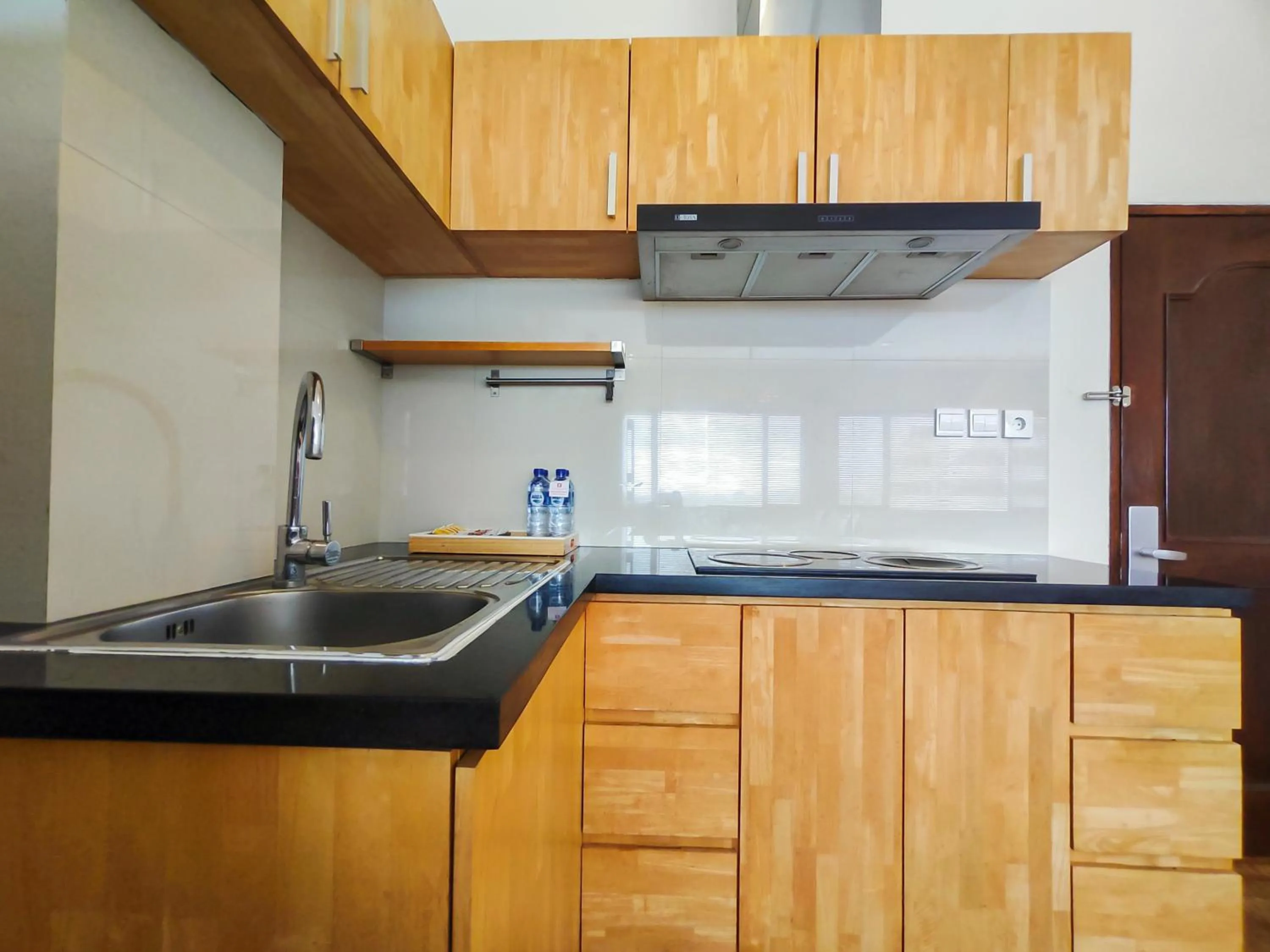 Kitchen or kitchenette in Seminyak Square Hotel And Villas