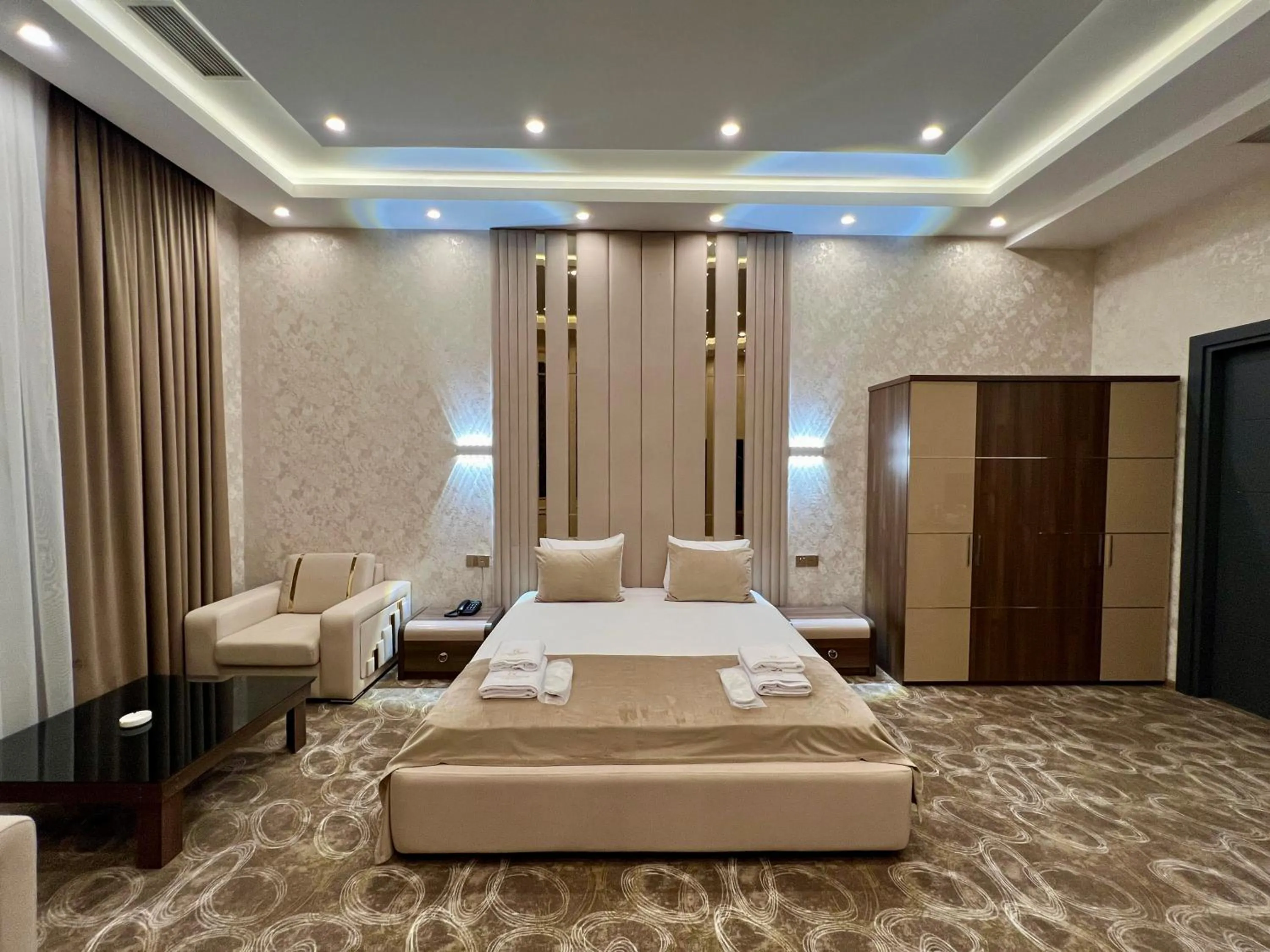 Bed in Royal Mansion Hotel