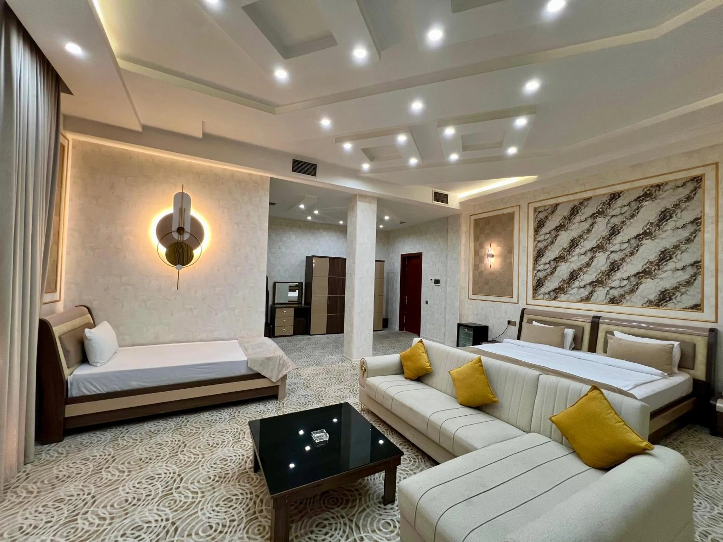 Seating area, Bed in Royal Mansion Hotel